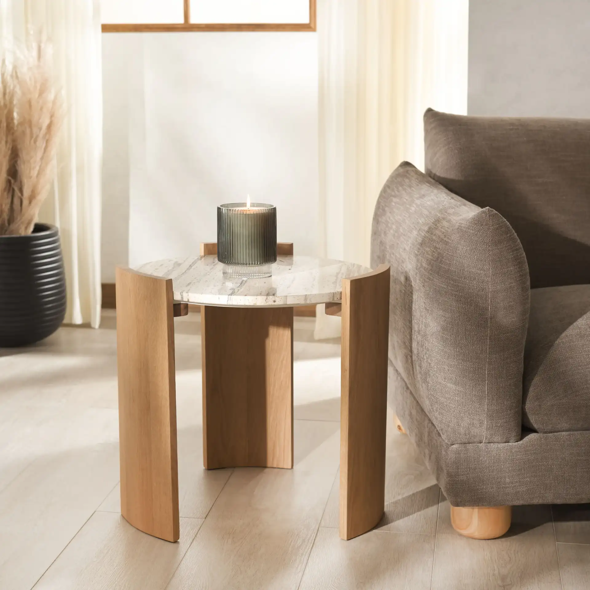 Damarcus Travertine Accent Table in Natural / Travertine in a styled room