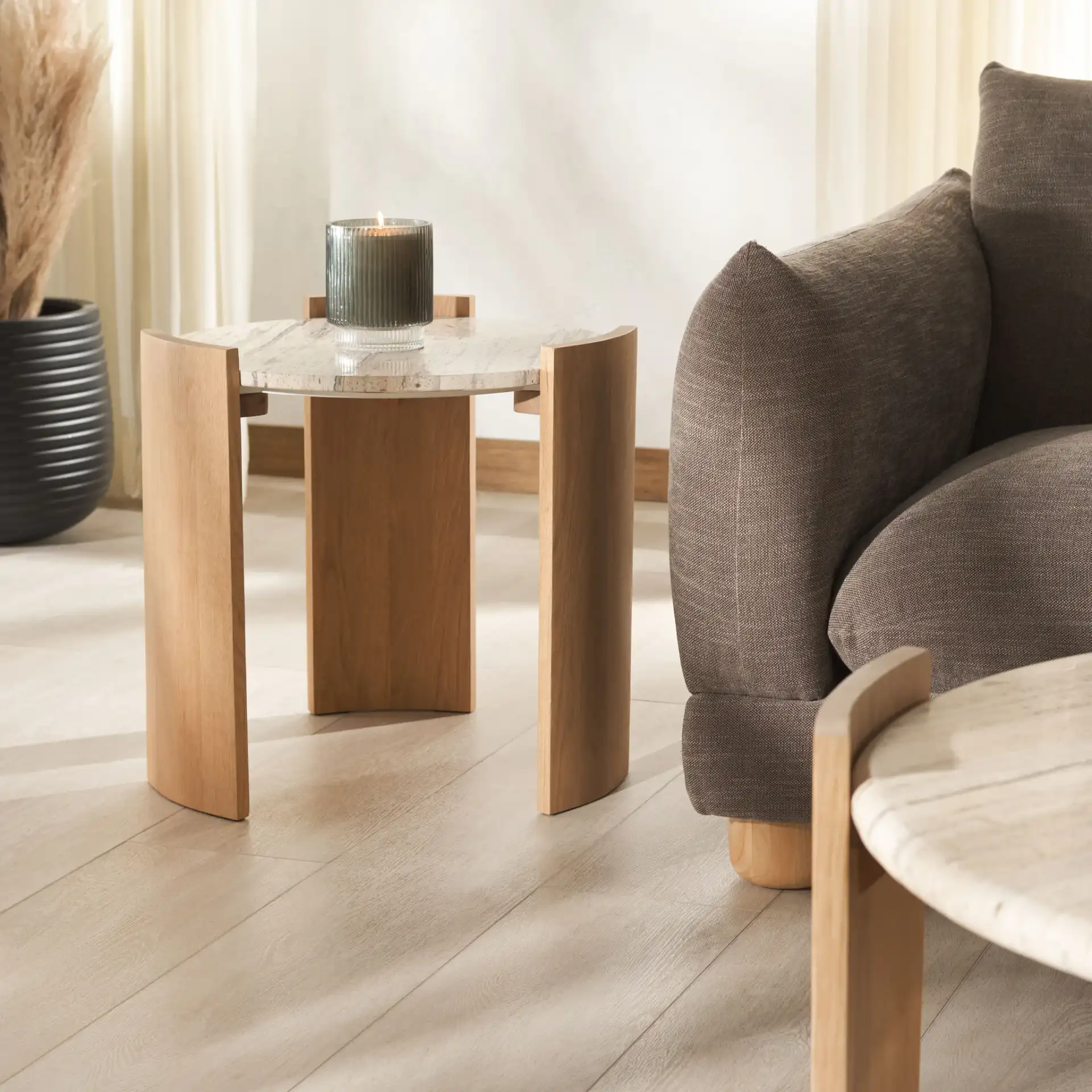 Damarcus Travertine Accent Table in Natural / Travertine in a styled room