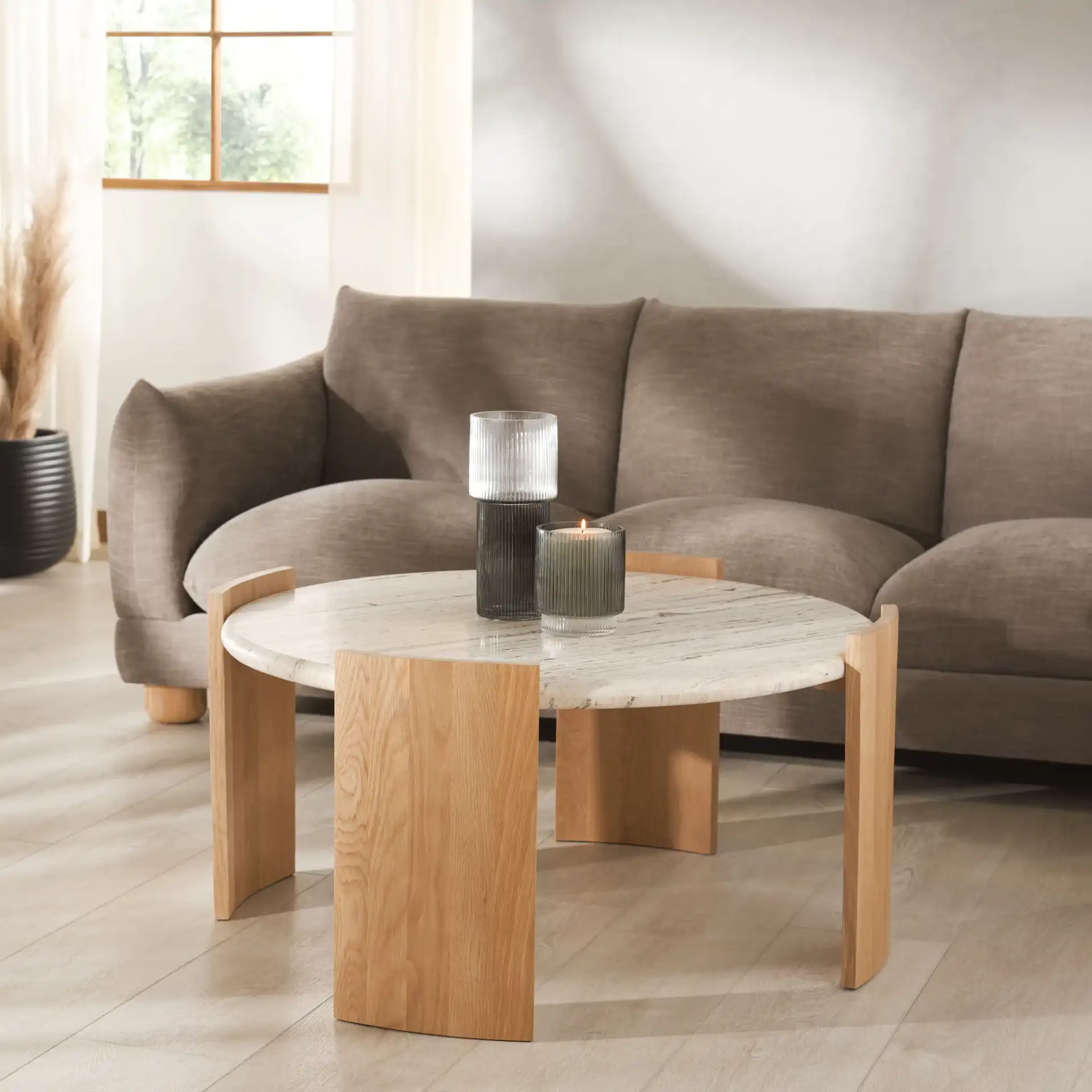 Damarcus Travertine Coffee Table in Natural / Travertine in a styled room