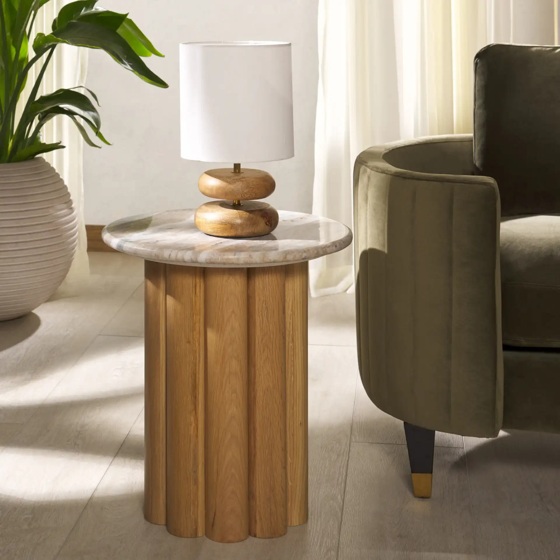 Roxiella Marble Accent Table in Brown / Natural in a styled room