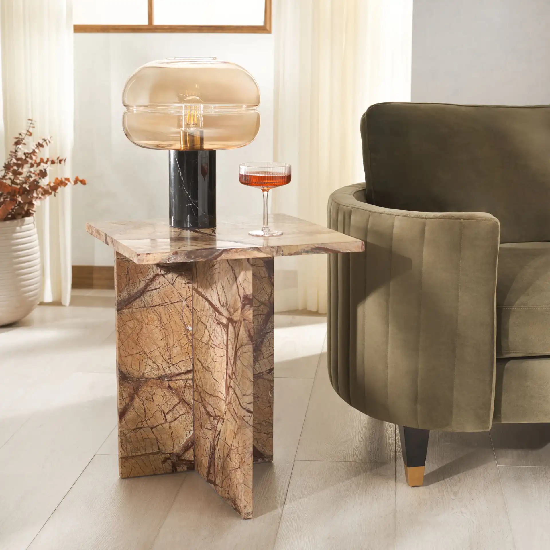 Adriano Marble Accent Table in Beige / Brown in a styled room
