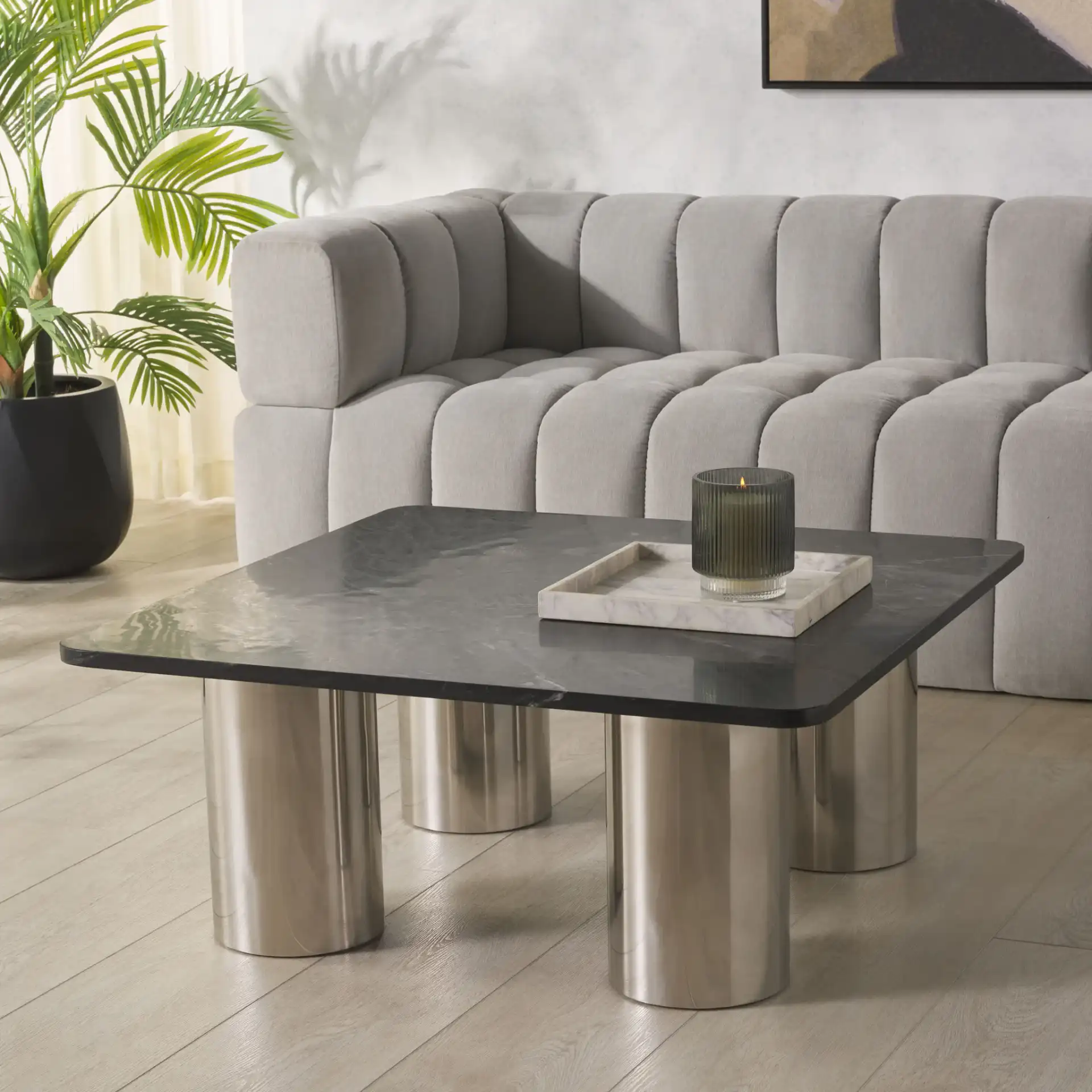 Belynda Marble Top Coffee Table in Black / Chrome in a styled room