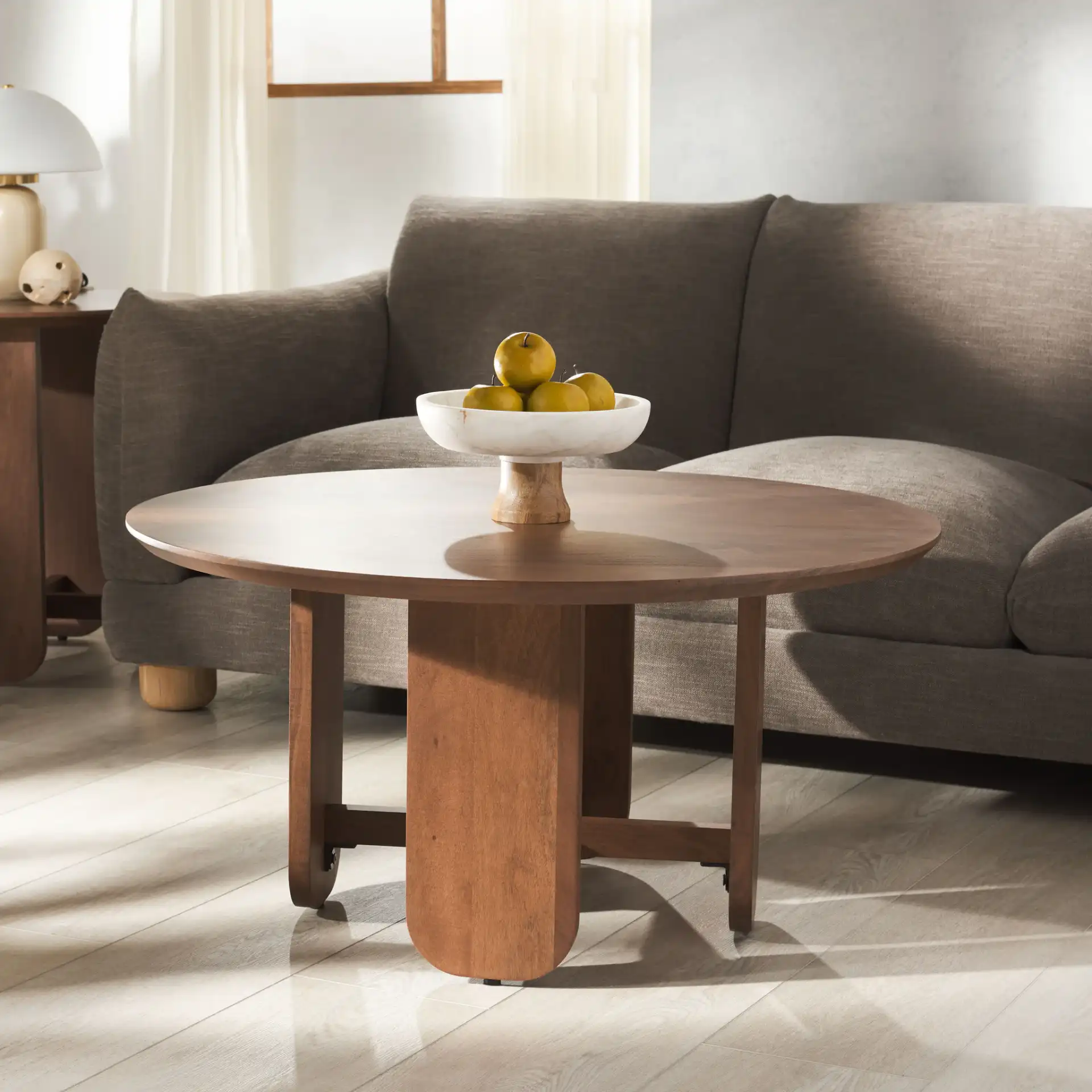 Raybelina Round Coffee Table in Walnut in a styled room