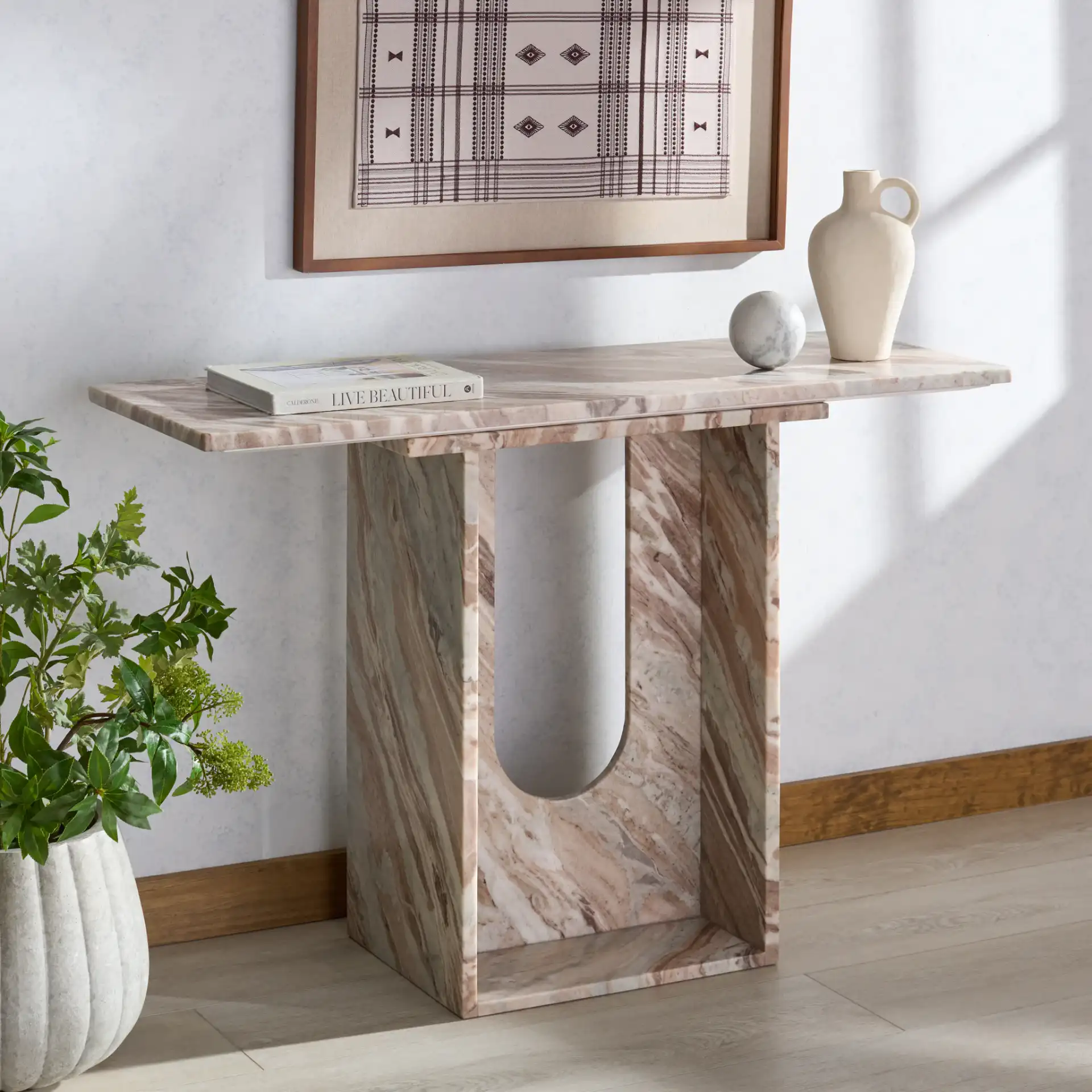 Tobilyn Marble Console Table in White / Brown in a styled room