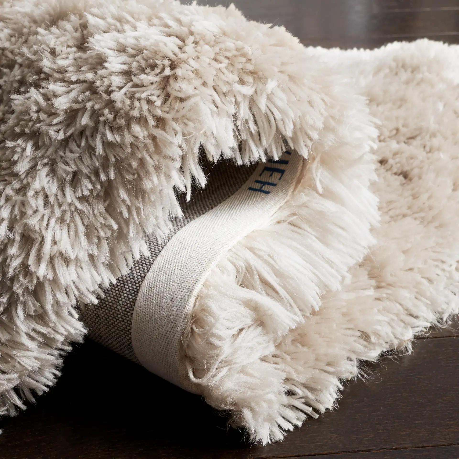 Arctic Solid Hand-Tufted Shag Rug in Light Beige in a styled room