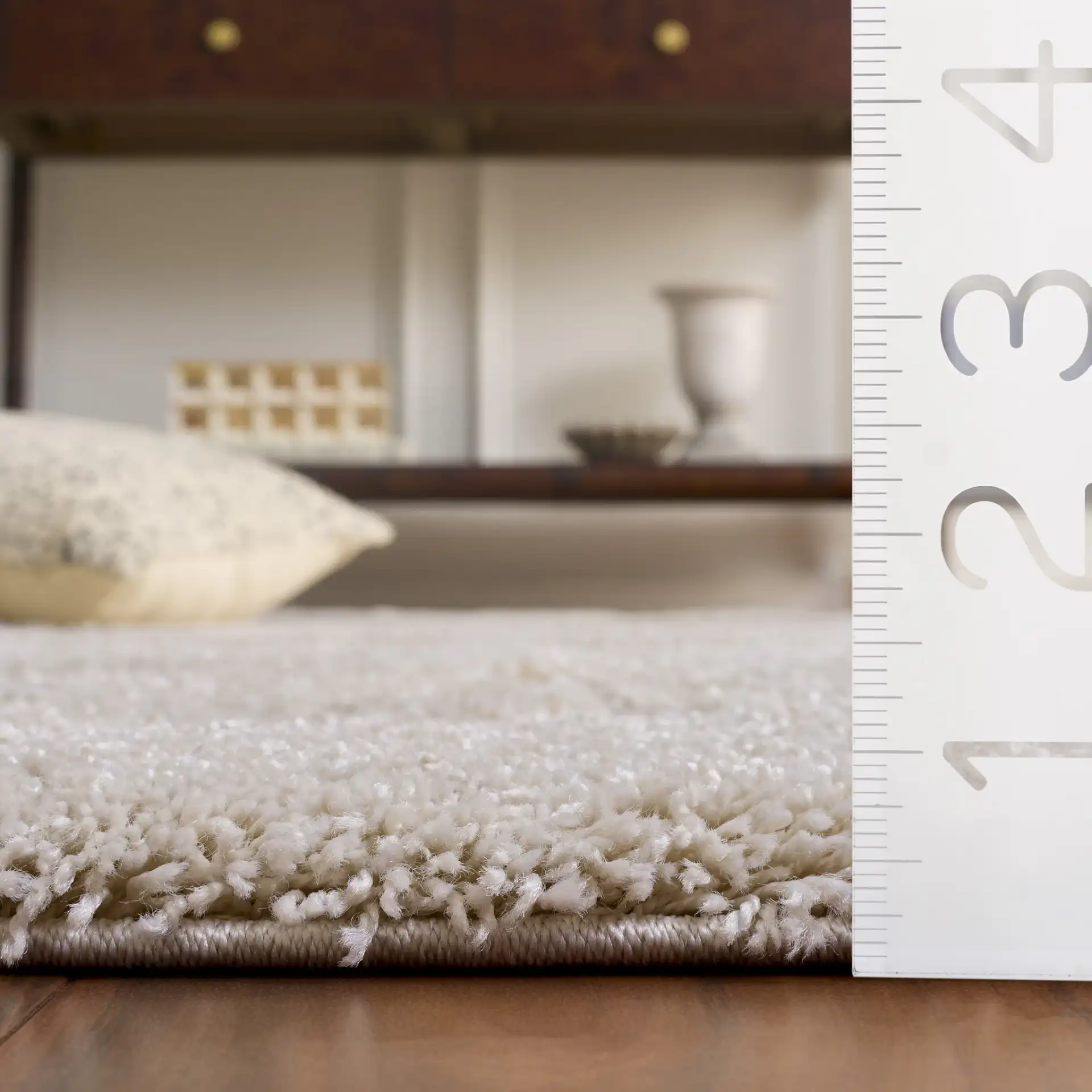 Florida Scrolling Leaf Shag Rug in Cream in a styled room
