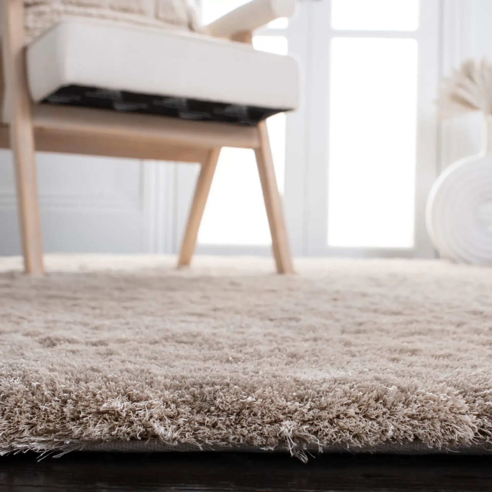 Paris Solid Hand-Tufted Shag Rug in Dark Beige in a styled room