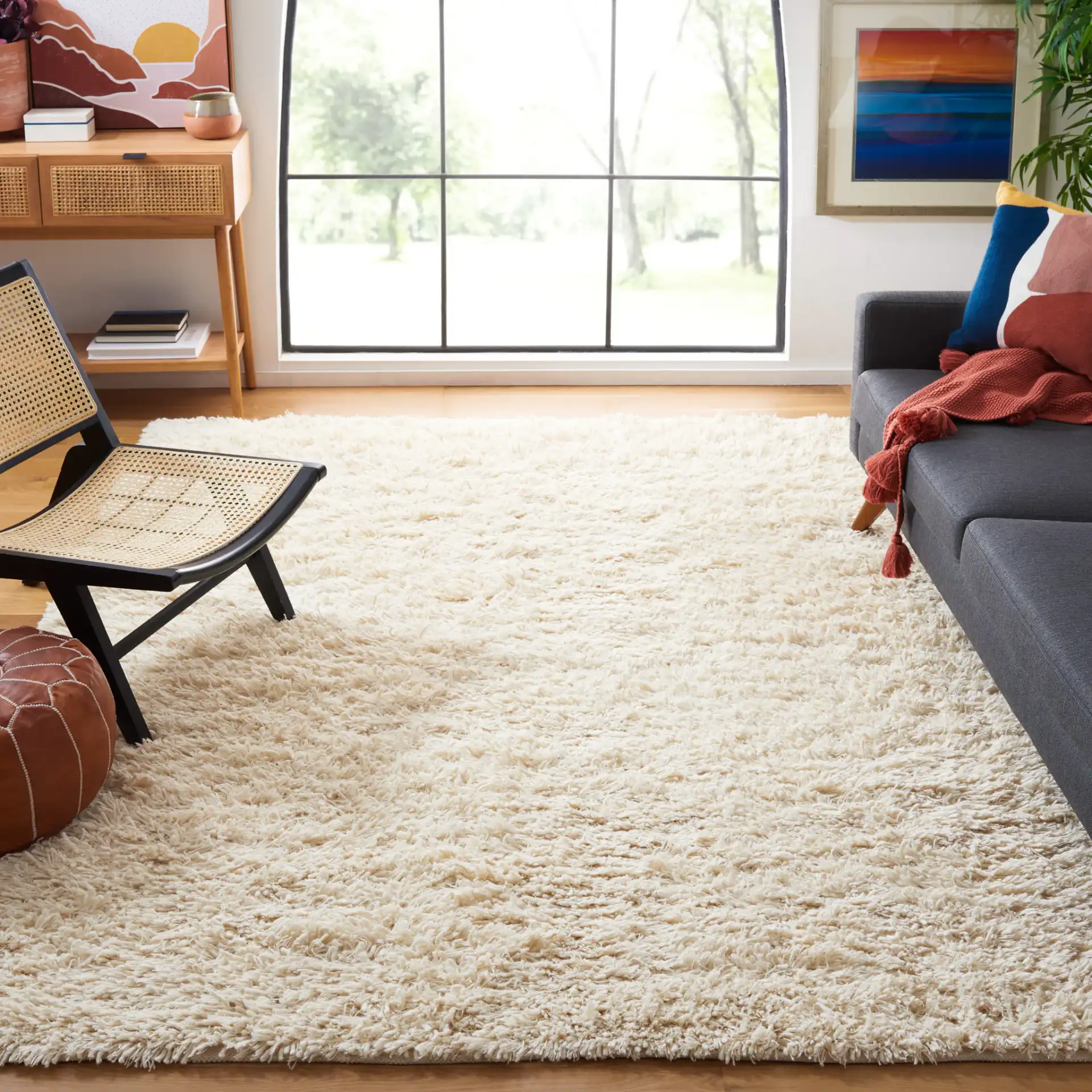 Carmel Solid Hand-Woven Wool Shag Rug in Ivory in a styled room