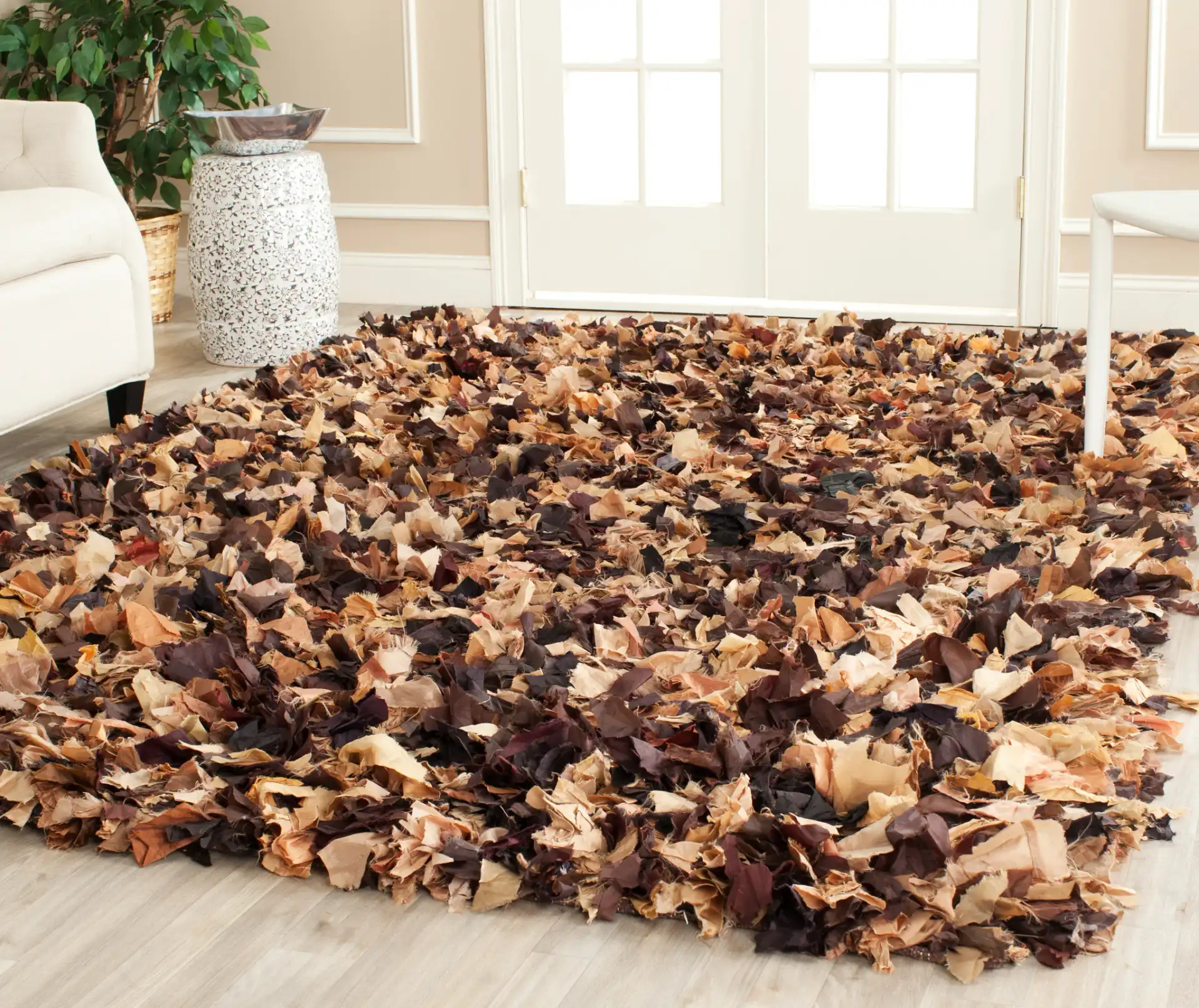Rio Textured Solid Hand-Woven Shag Rug in Brown / Multicolor in a styled room
