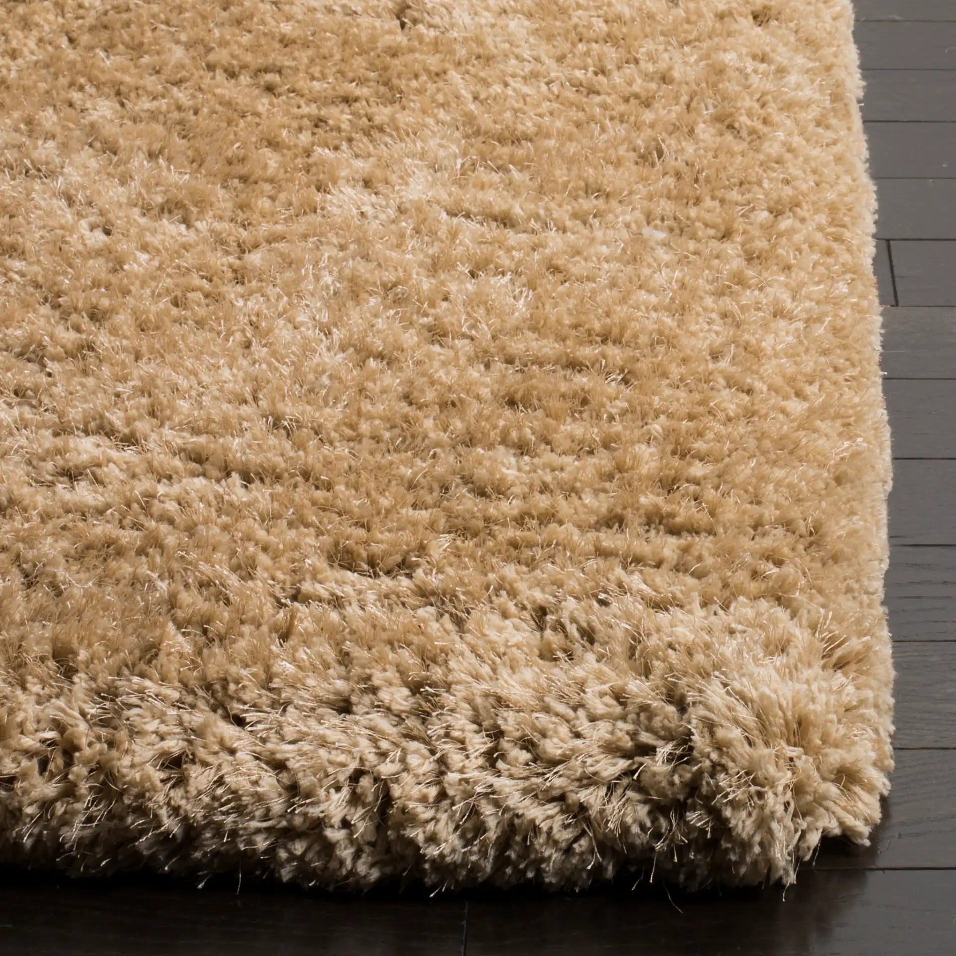 Express Solid Hand-Tufted Shag Rug in Beige in a styled room