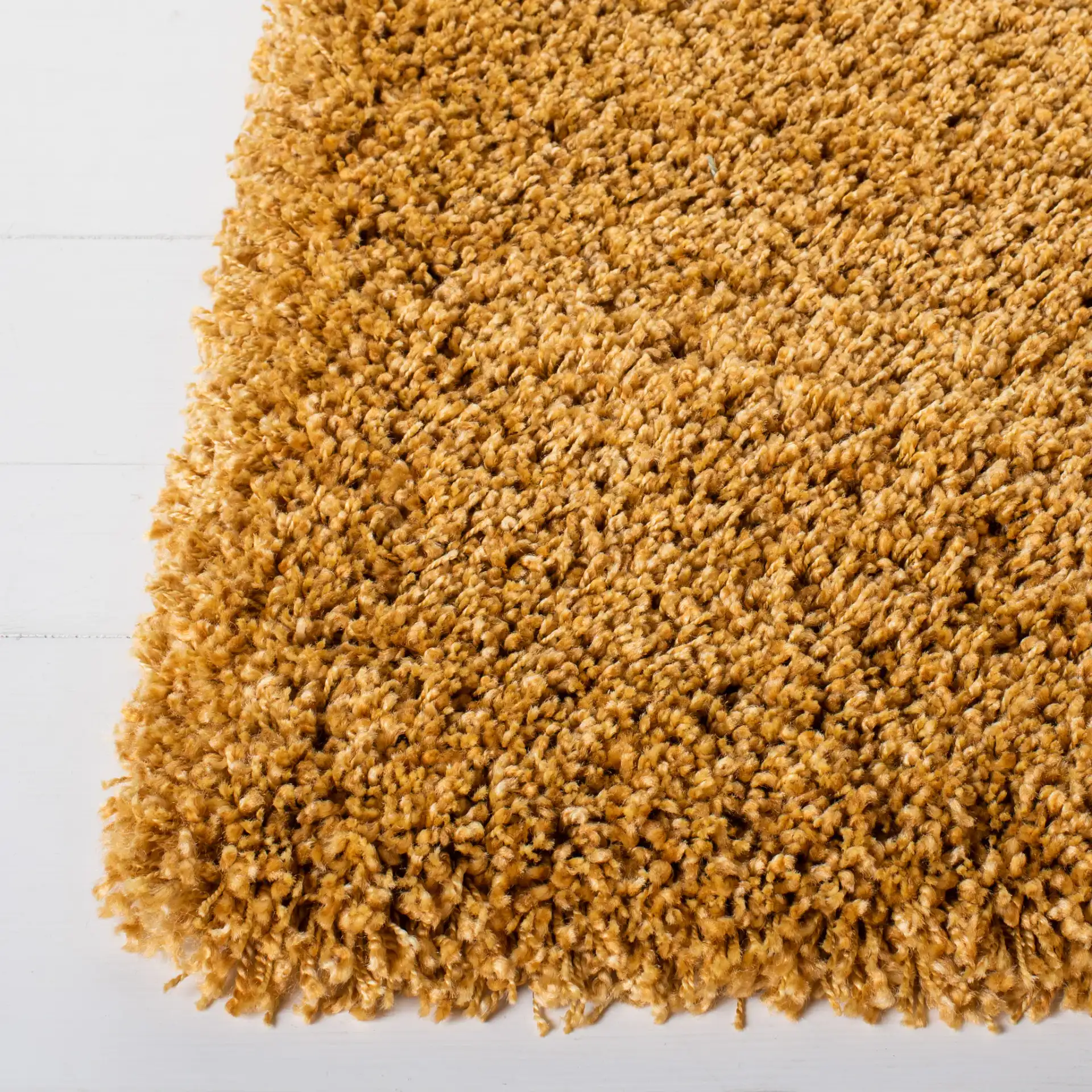 Hudson Solid Shag Rug in Gold in a styled room