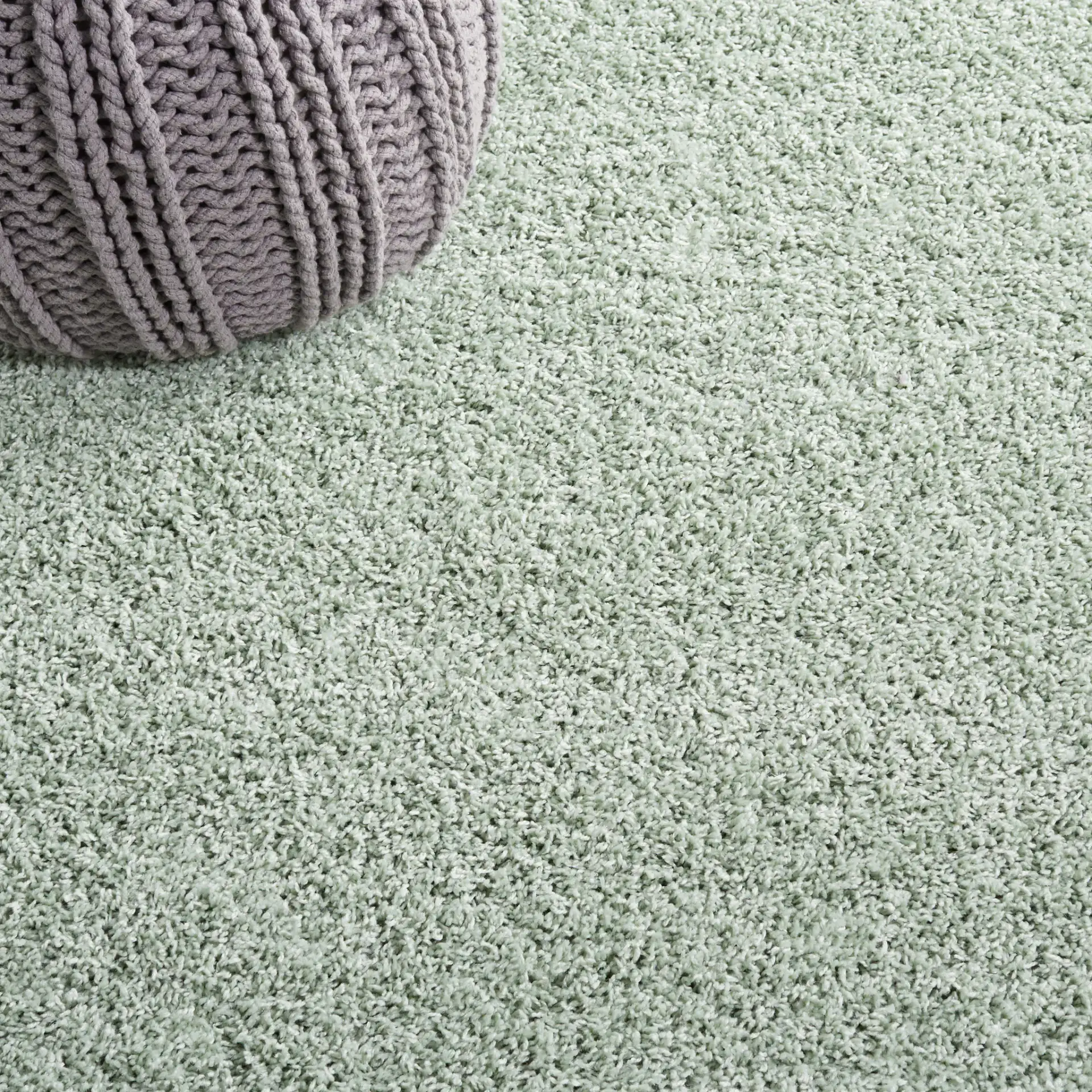 Laguna Solid Shag Rug in Light Sage in a styled room