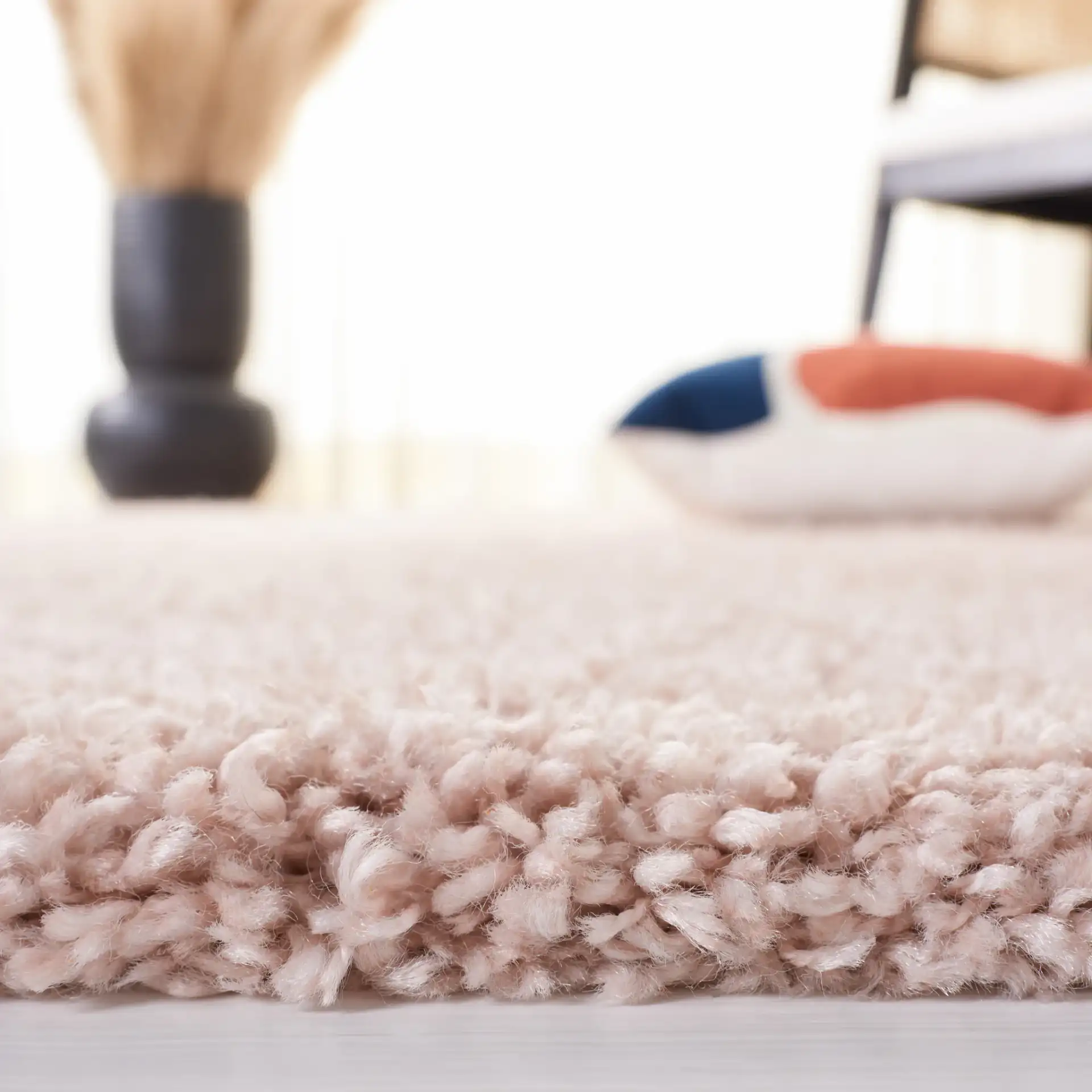 Solo Solid Shag Rug in Beige in a styled room