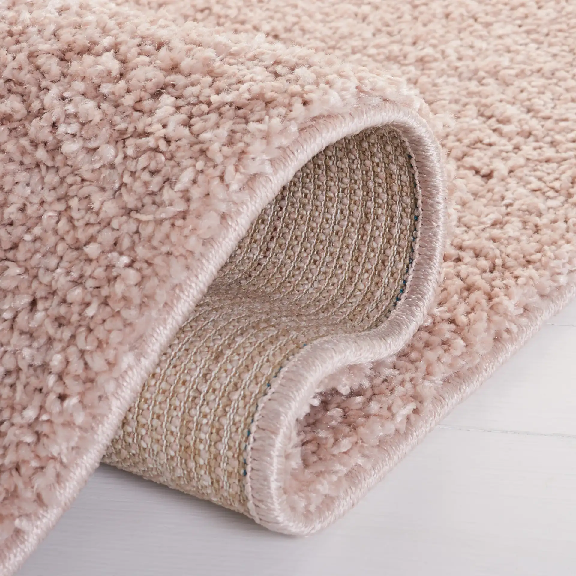 Solo Solid Shag Rug in Beige in a styled room