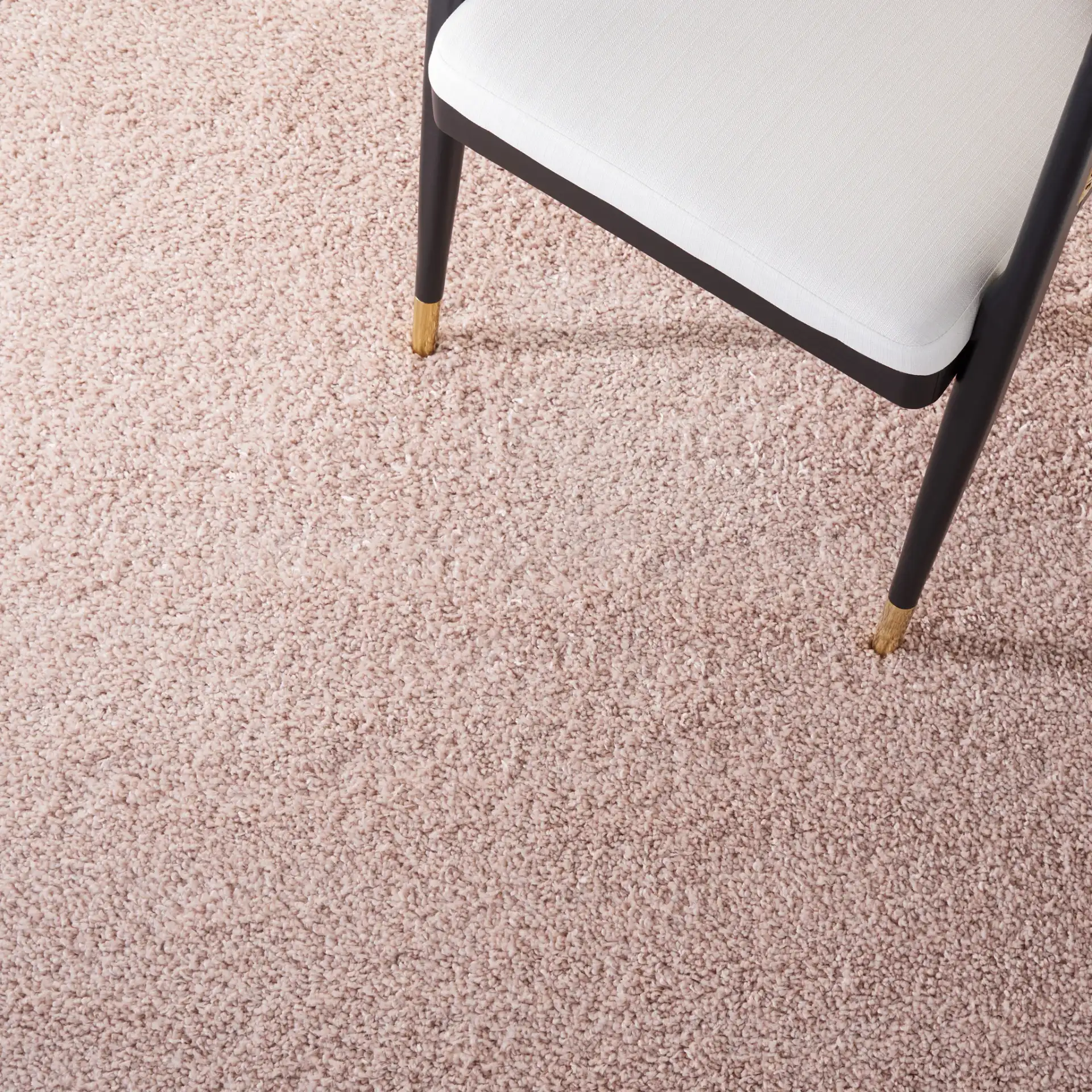 Solo Solid Shag Rug in Beige in a styled room