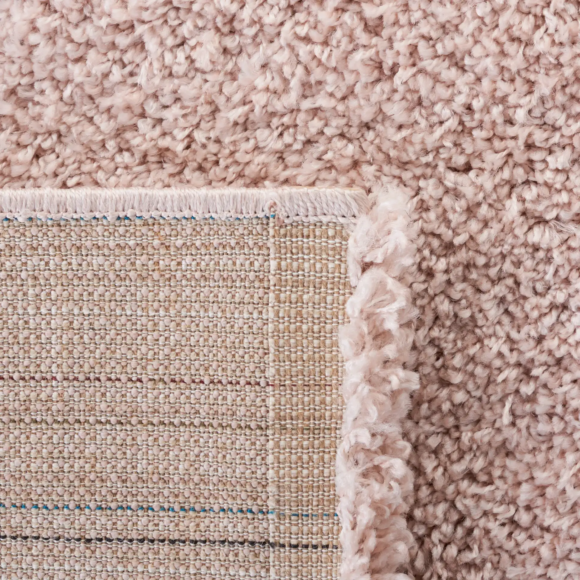 Solo Solid Shag Rug in Beige in a styled room