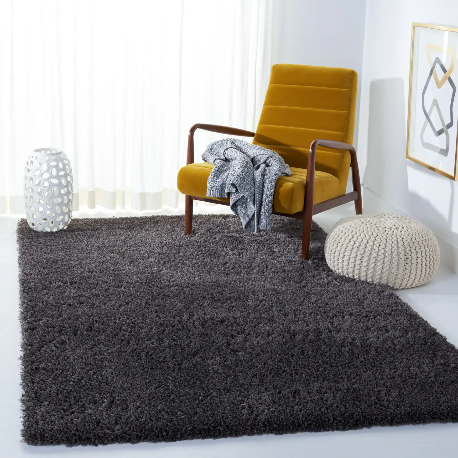 Reno Solid Shag Rug in Dark Gray in a styled room