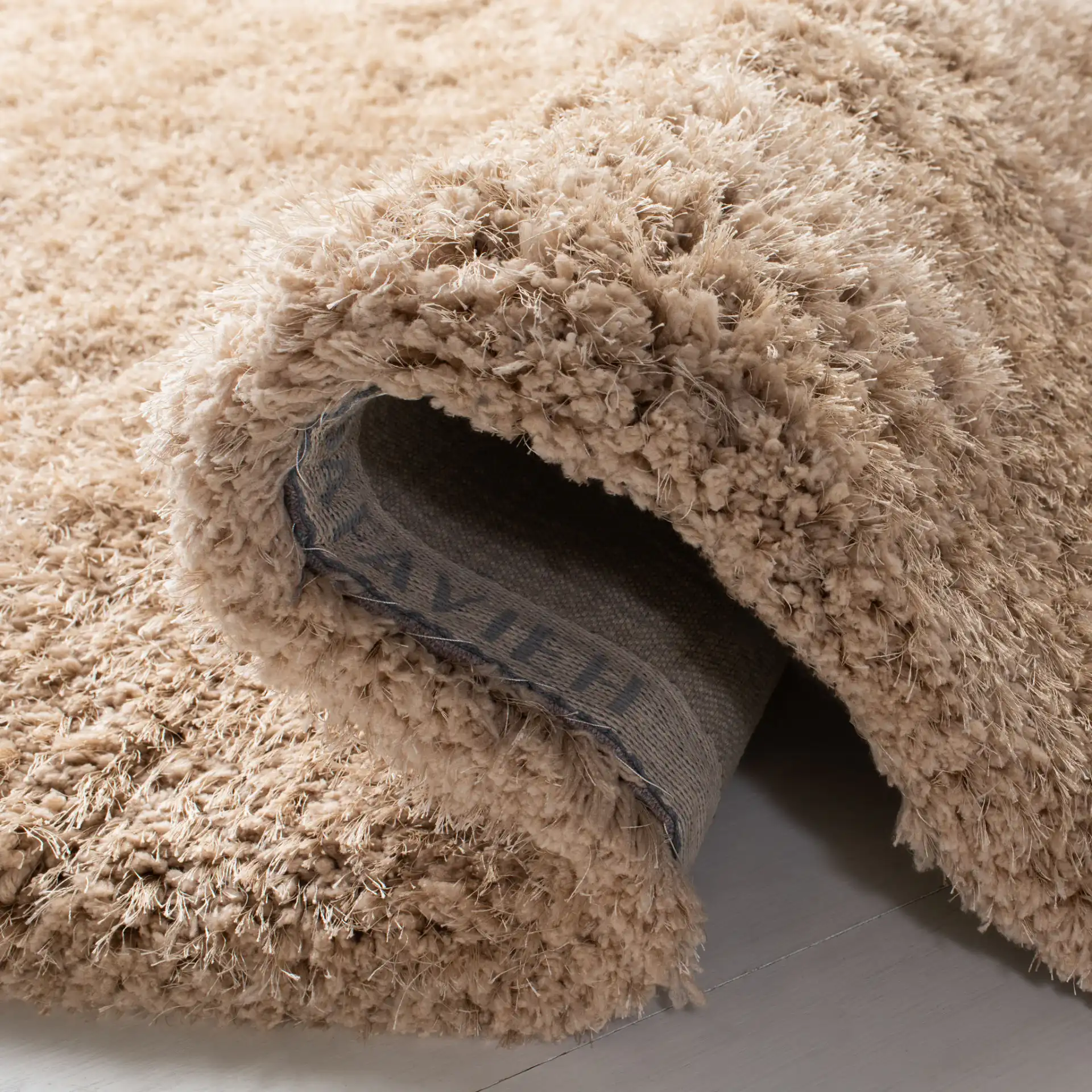 Supreme Solid Hand-Tufted Shag Rug in Beige