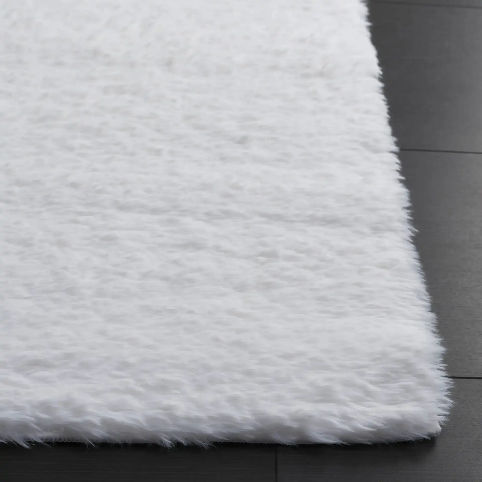 Tokyo Shag Solid Washable Rug in Ivory in a styled room