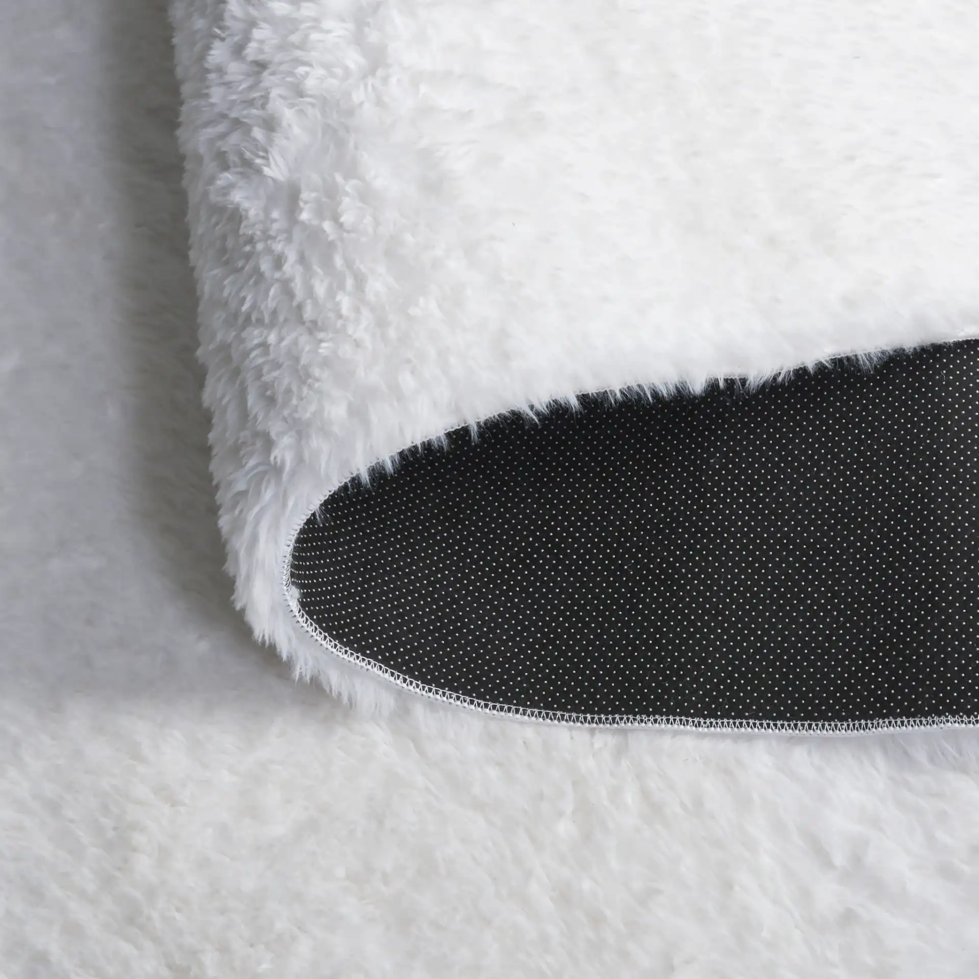 Tokyo Shag Solid Washable Rug in Ivory in a styled room