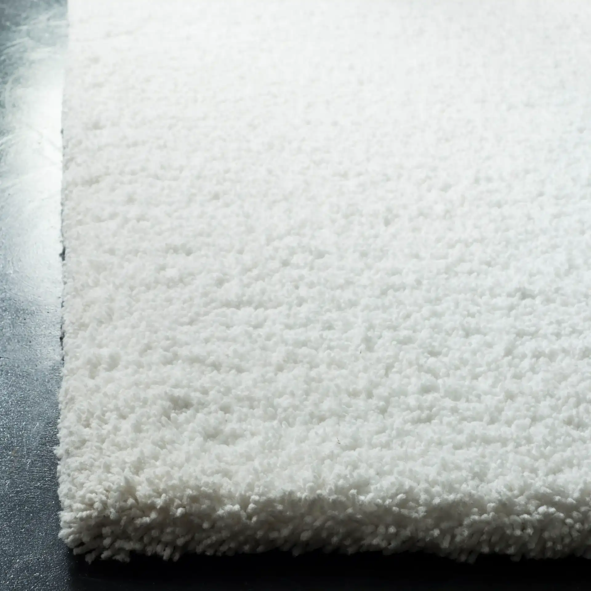 Ultimate Solid Hand-Tufted Shag Rug in Ivory in a styled room