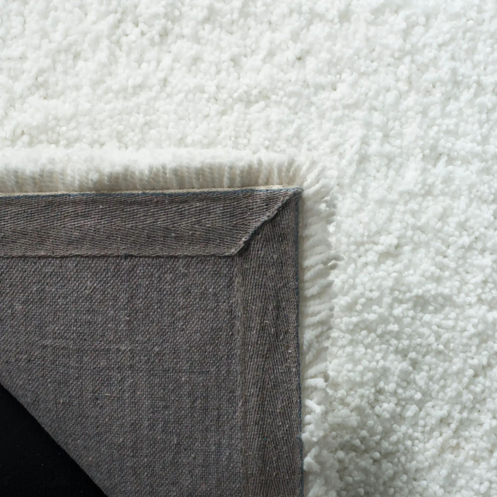 Ultimate Solid Hand-Tufted Shag Rug in Ivory in a styled room
