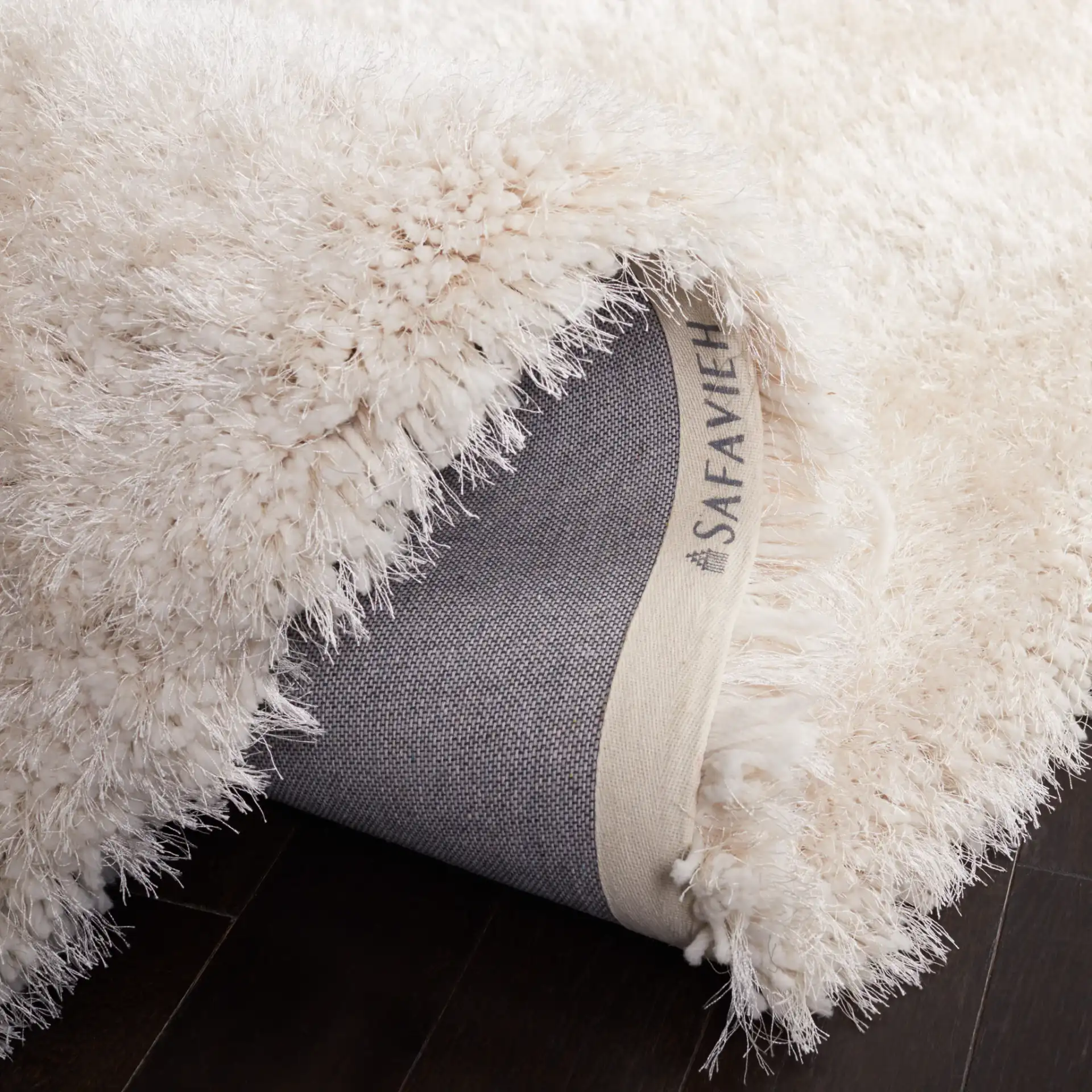Luxe Solid Hand-Tufted Shag Rug in Bone in a styled room