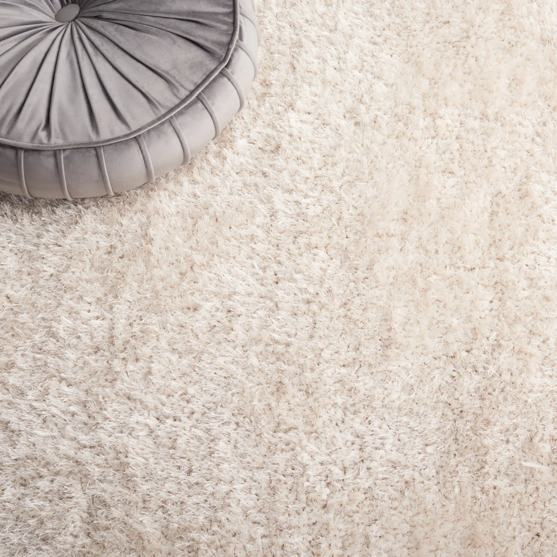 Luxe Solid Hand-Tufted Shag Rug in Bone in a styled room