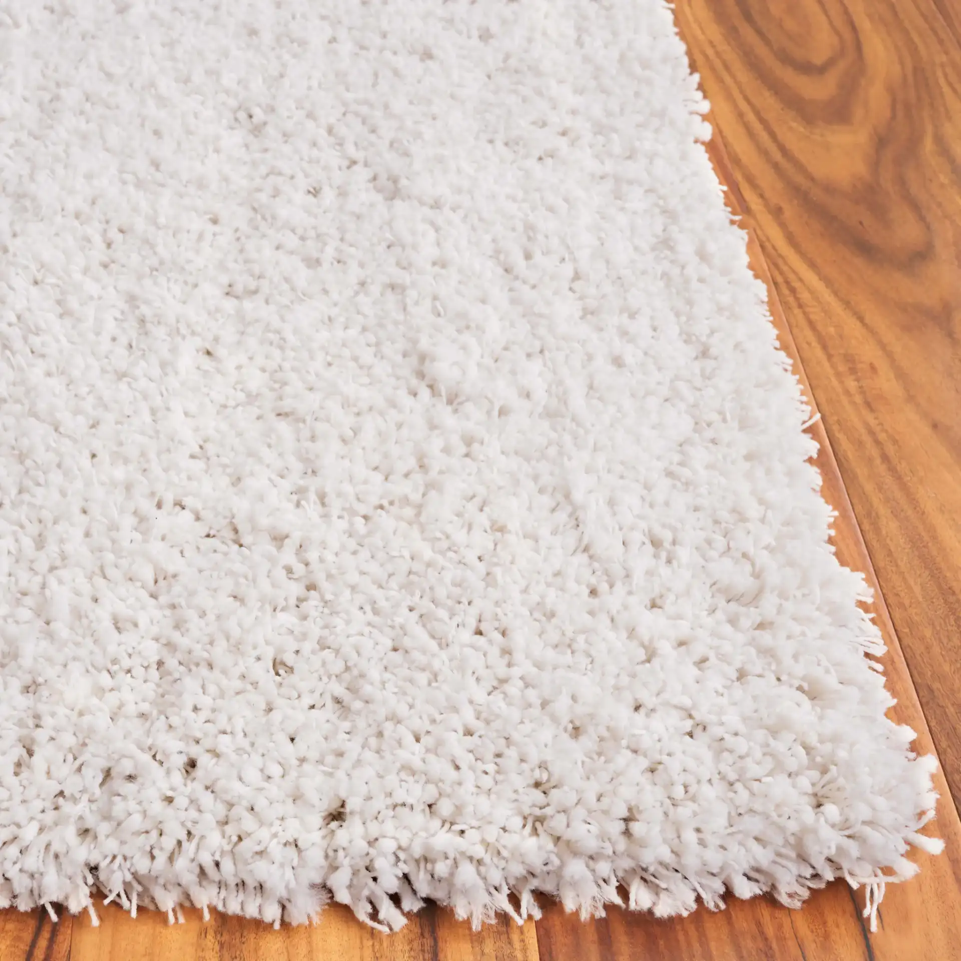 Luxe Solid Shag Rug in White in a styled room