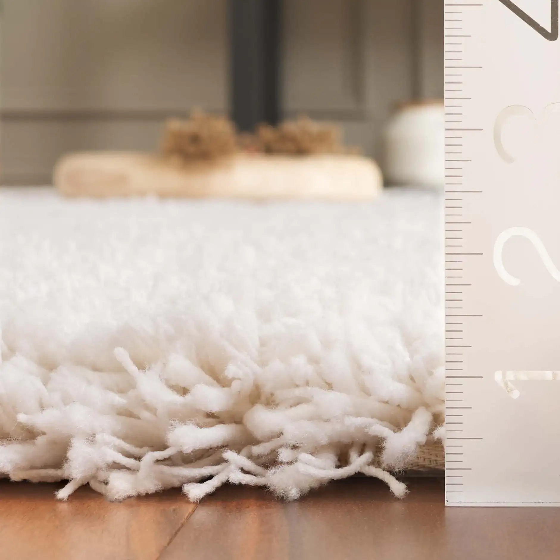 Luxe Solid Shag Rug in White in a styled room