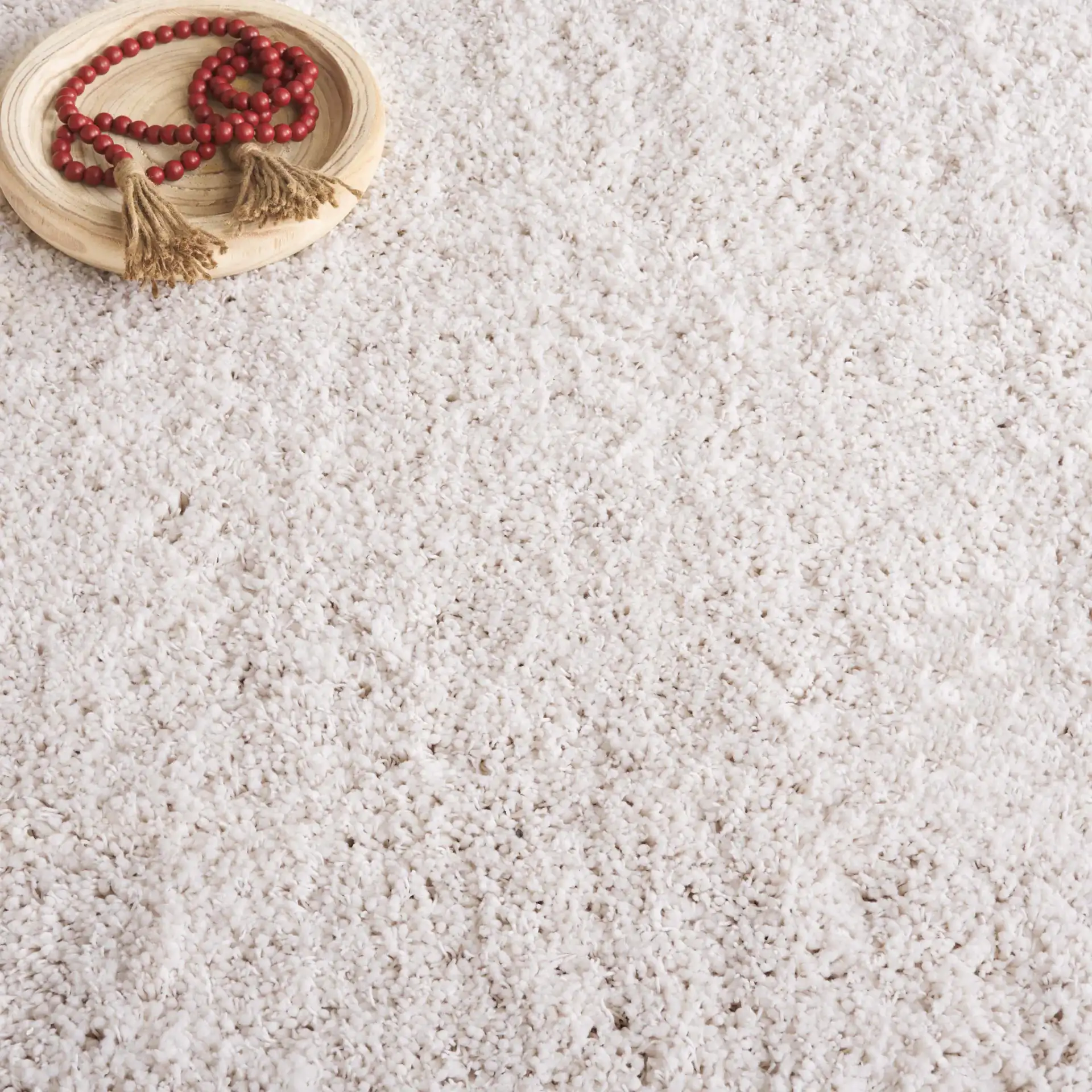 Luxe Solid Shag Rug in White in a styled room