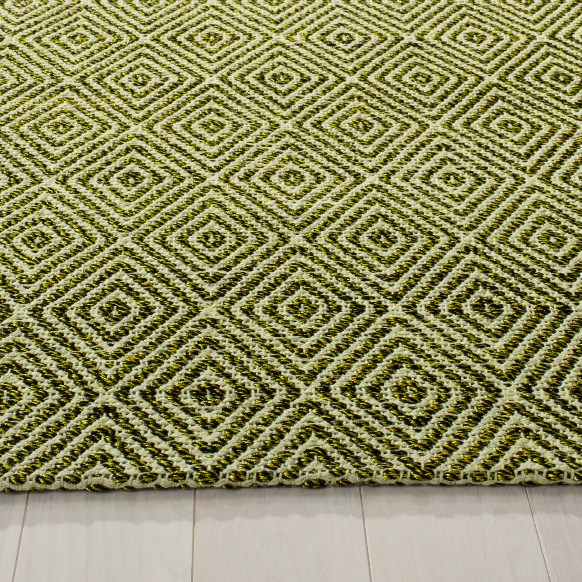 Southampton Diamond Hand-Woven Rug in Green in a styled room