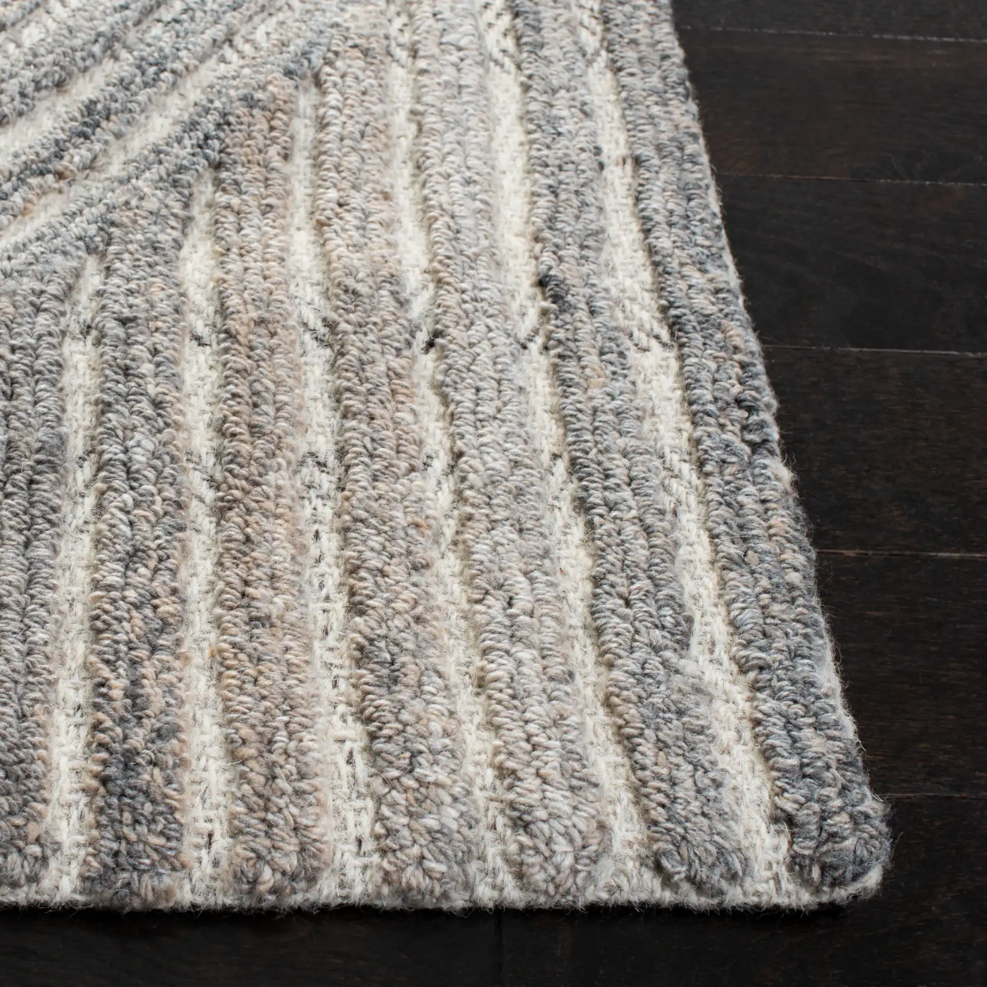 Southampton Curved Stripe Hand-Tufted Rug in Beige / Light Blue in a styled room