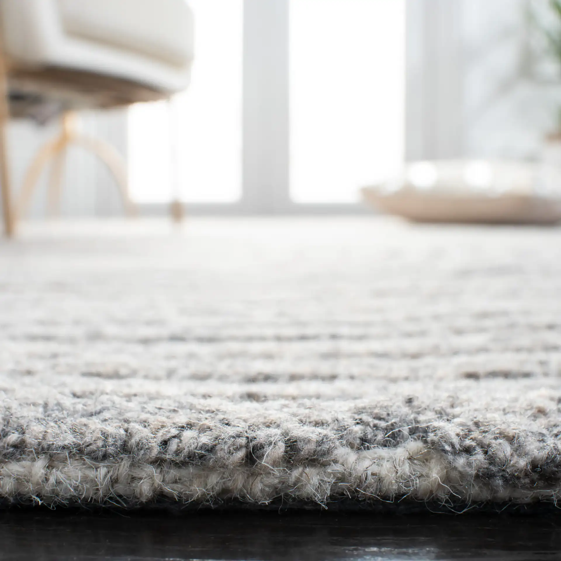 Southampton Curved Stripe Hand-Tufted Rug in Beige / Light Blue in a styled room
