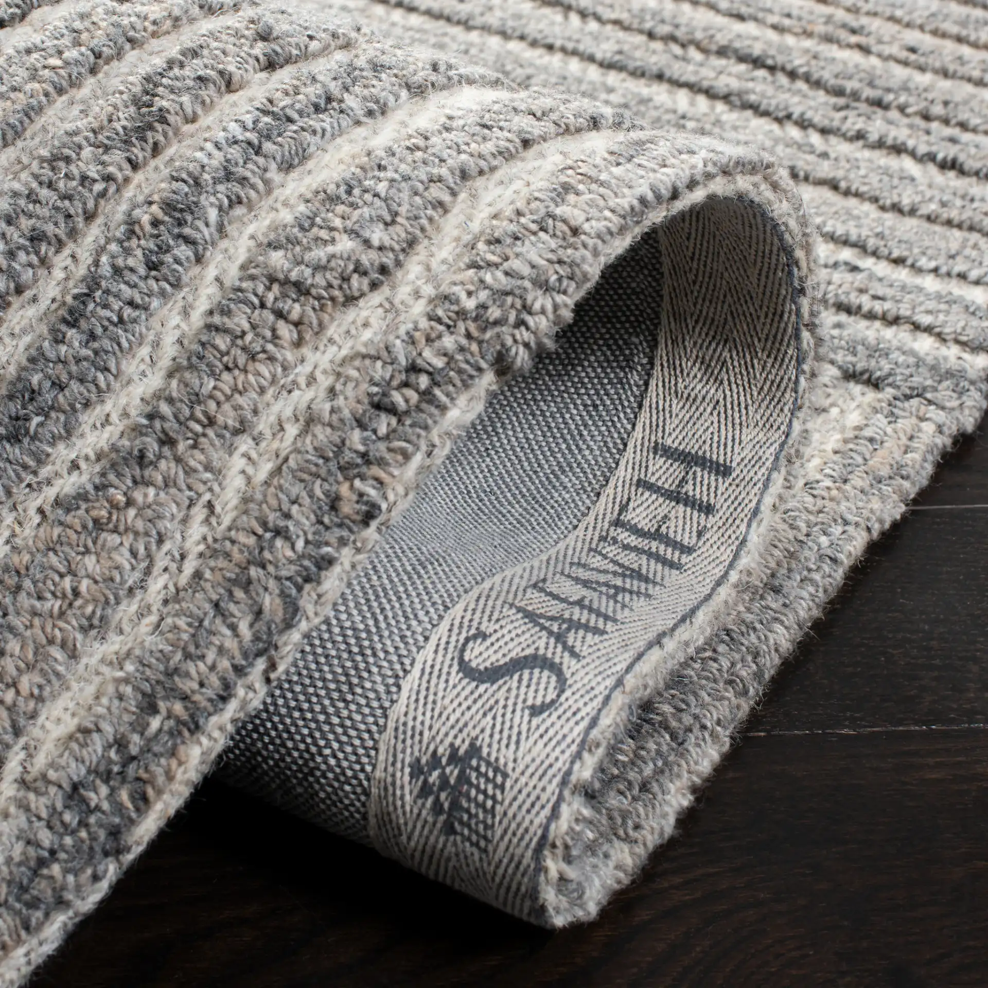 Southampton Curved Stripe Hand-Tufted Rug in Beige / Light Blue in a styled room