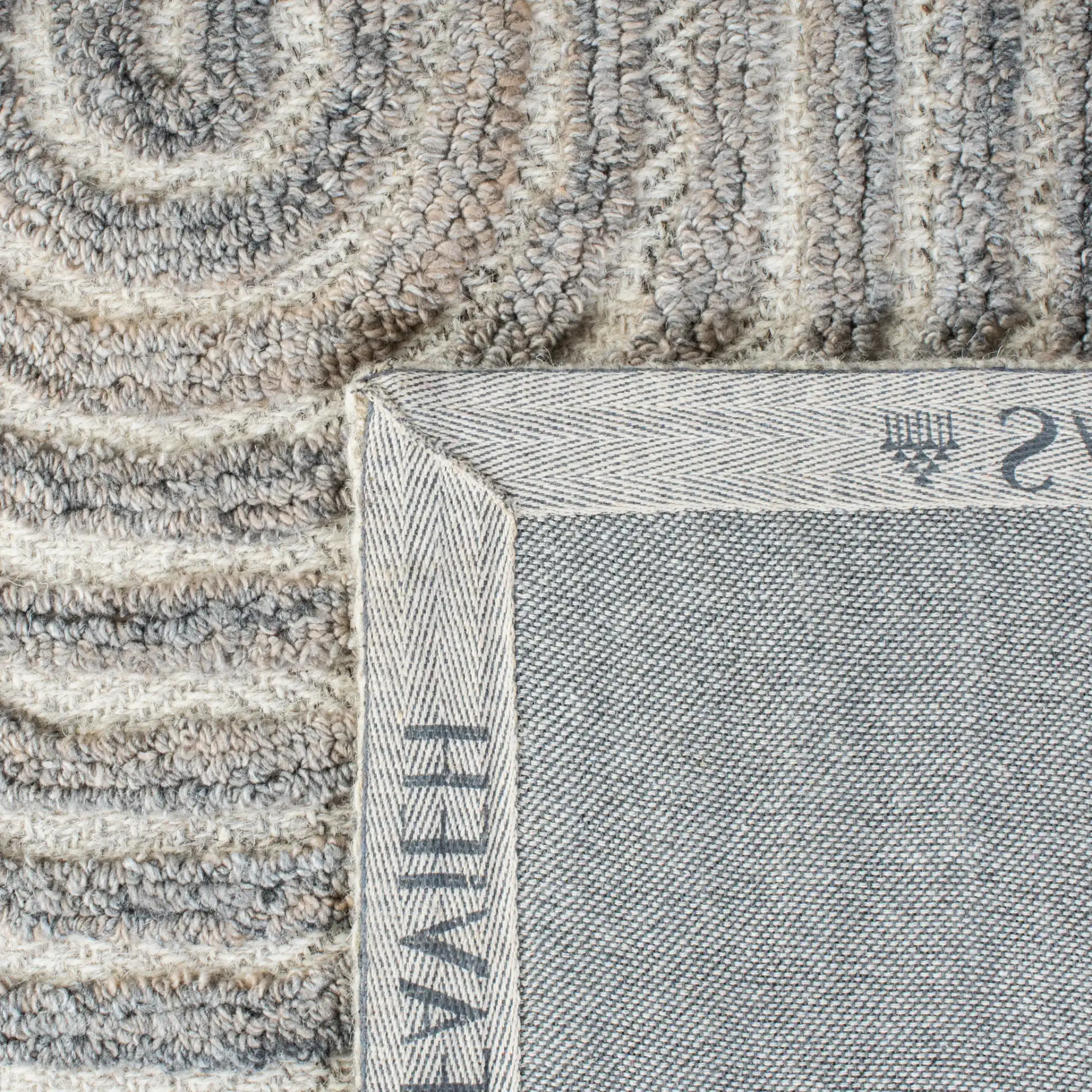 Southampton Curved Stripe Hand-Tufted Rug in Beige / Light Blue in a styled room