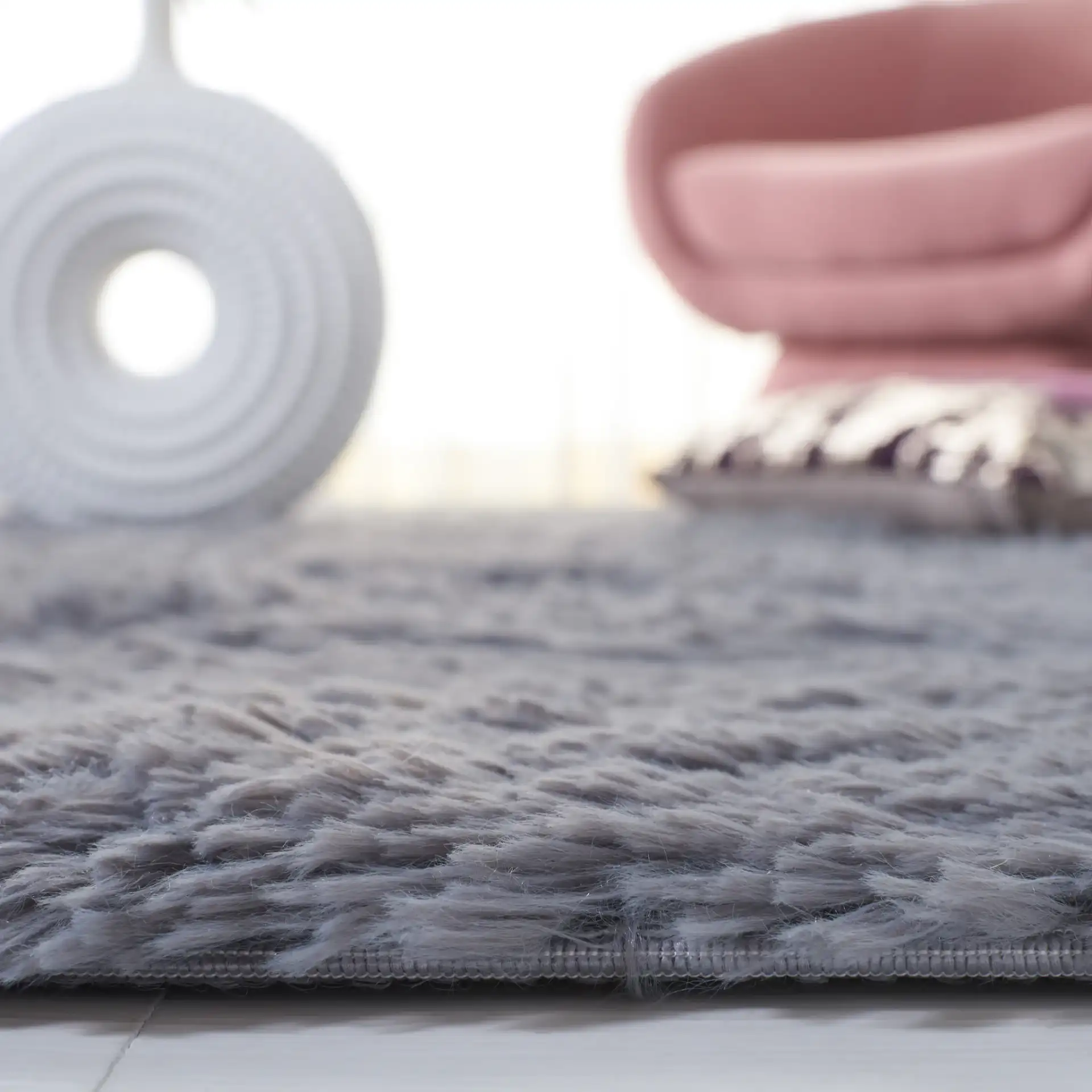 Soho Solid Washable Shag Rug in Dark Gray in a styled room