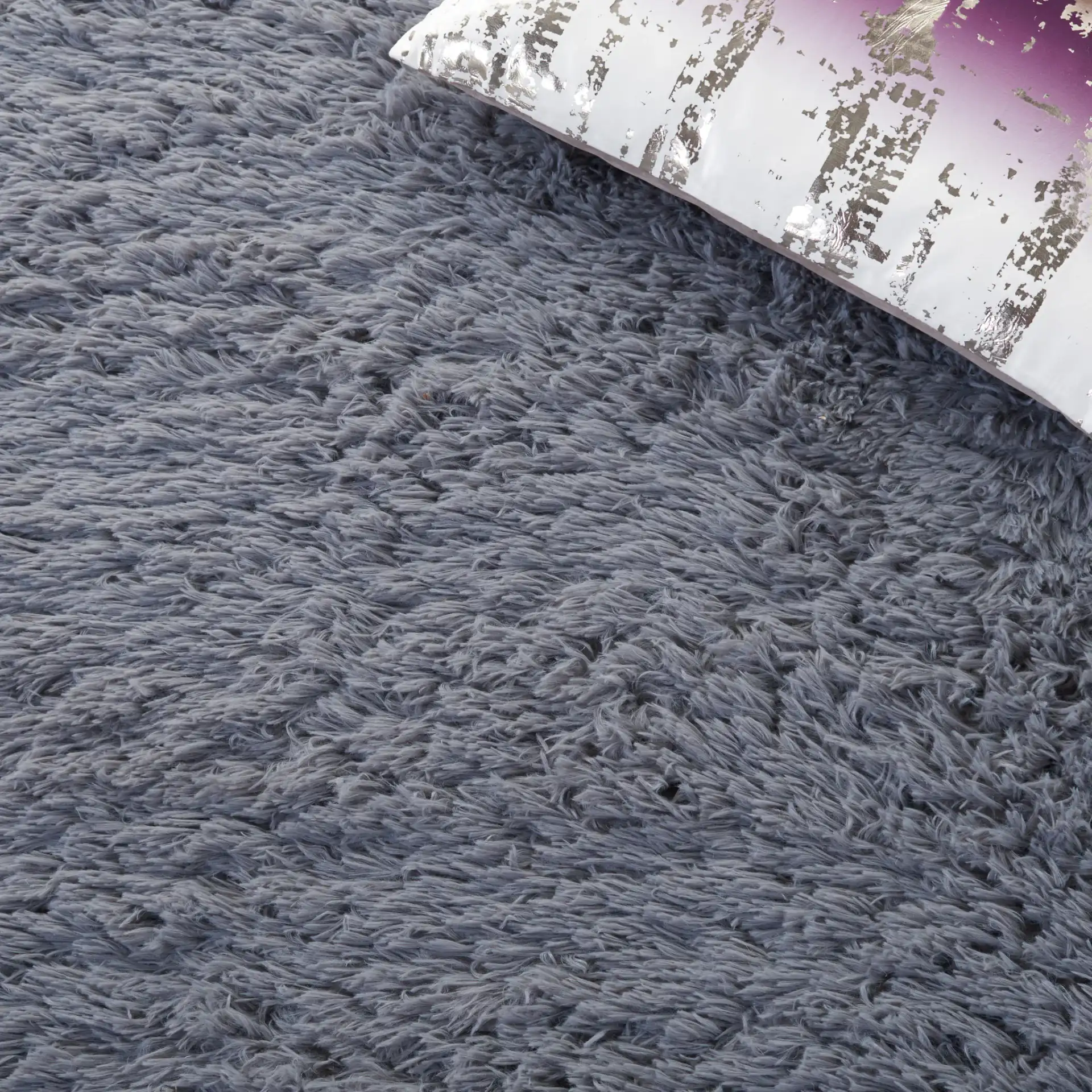 Soho Solid Washable Shag Rug in Dark Gray in a styled room