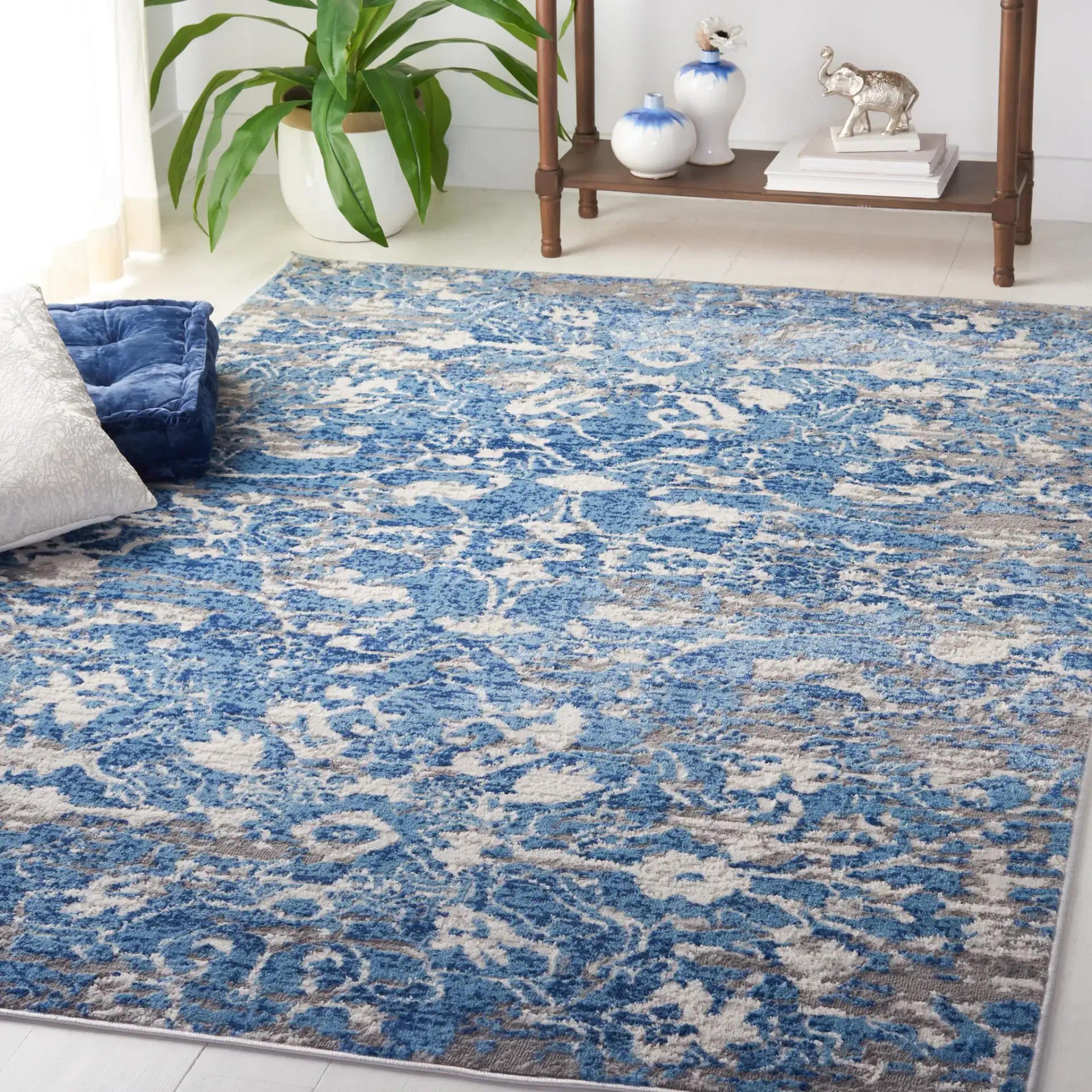 Shivan Distressed Damask Rug in Blue / Ivory in a styled room