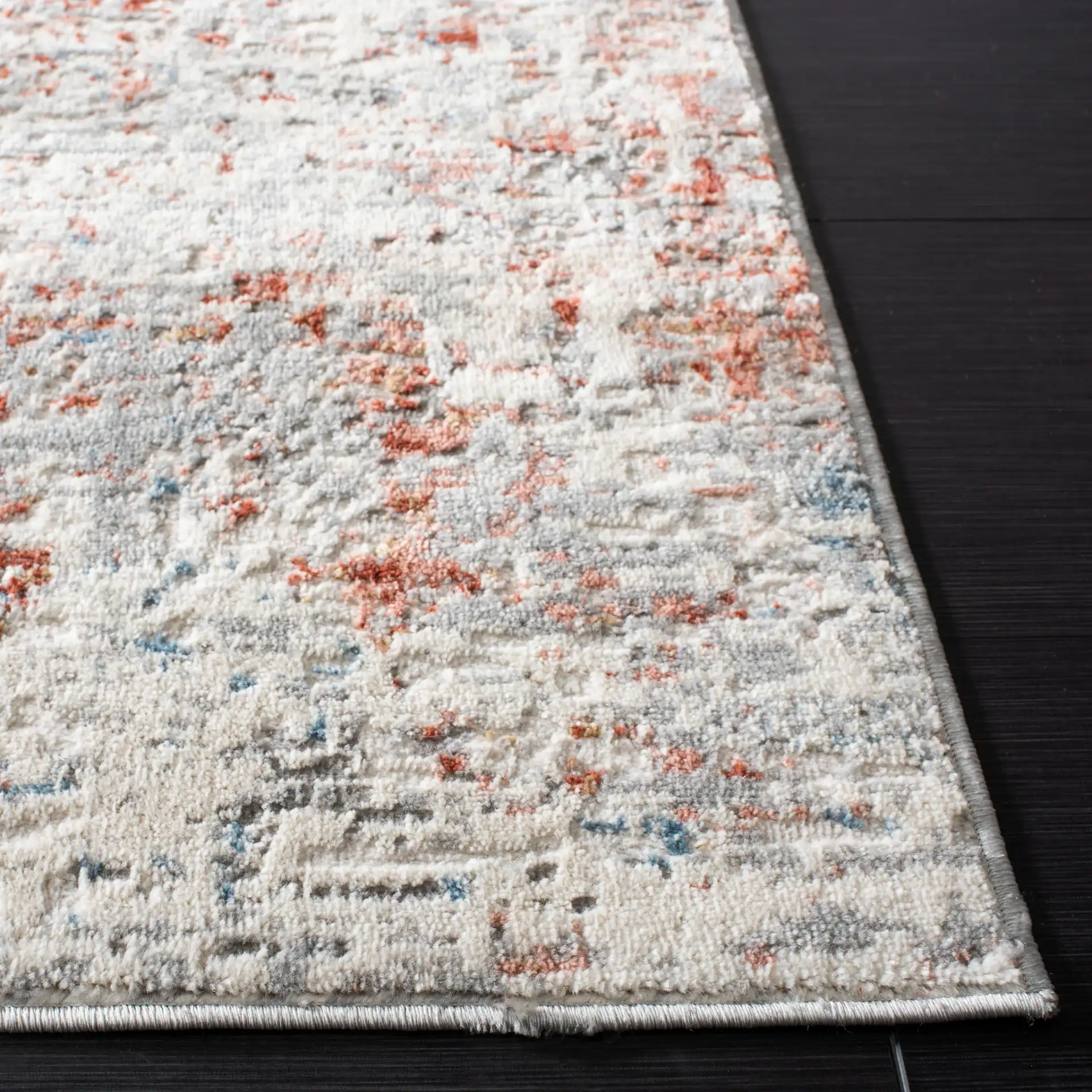 Shivan Abstract Mottled Rug in Ivory / Rust in a styled room