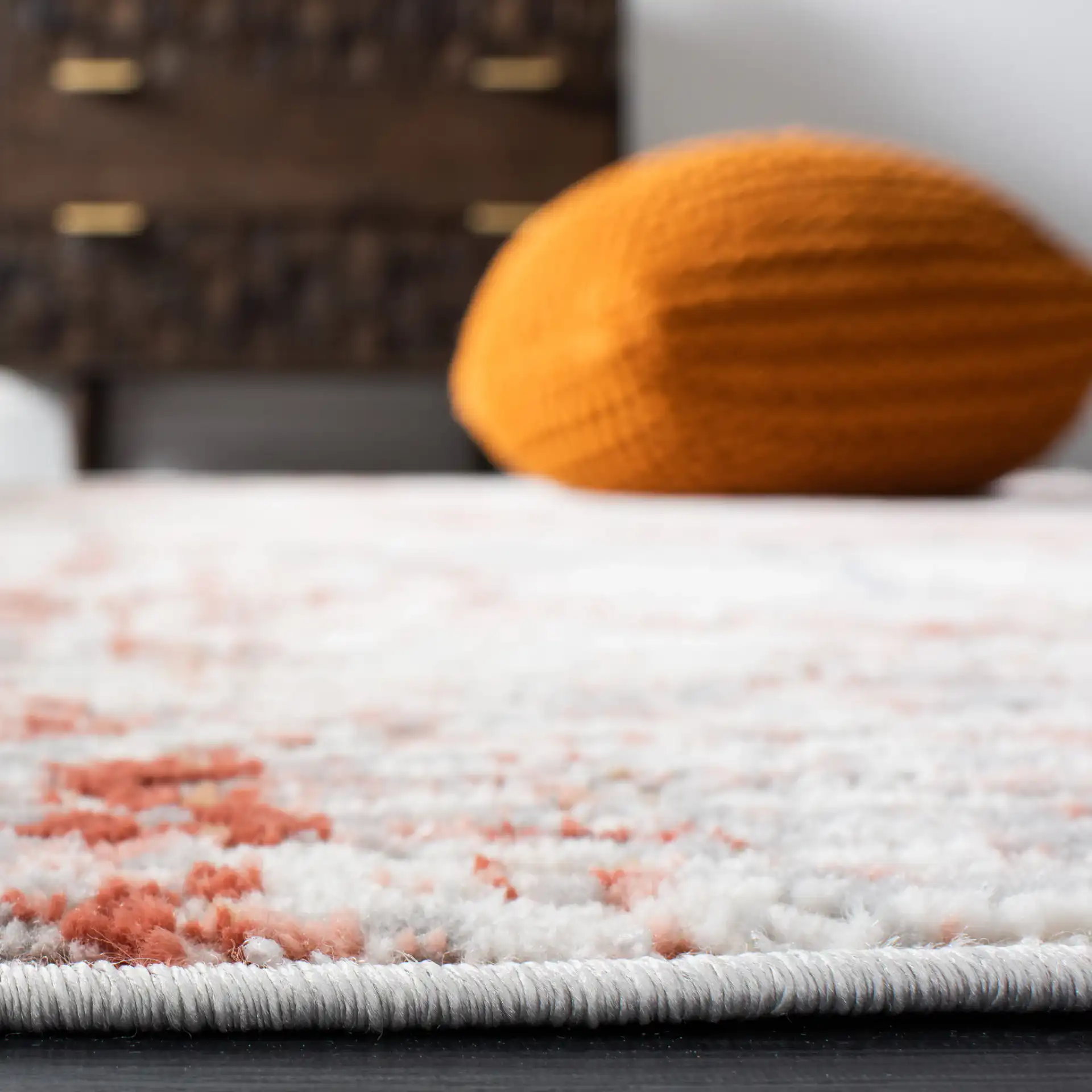 Shivan Abstract Mottled Rug in Ivory / Rust in a styled room