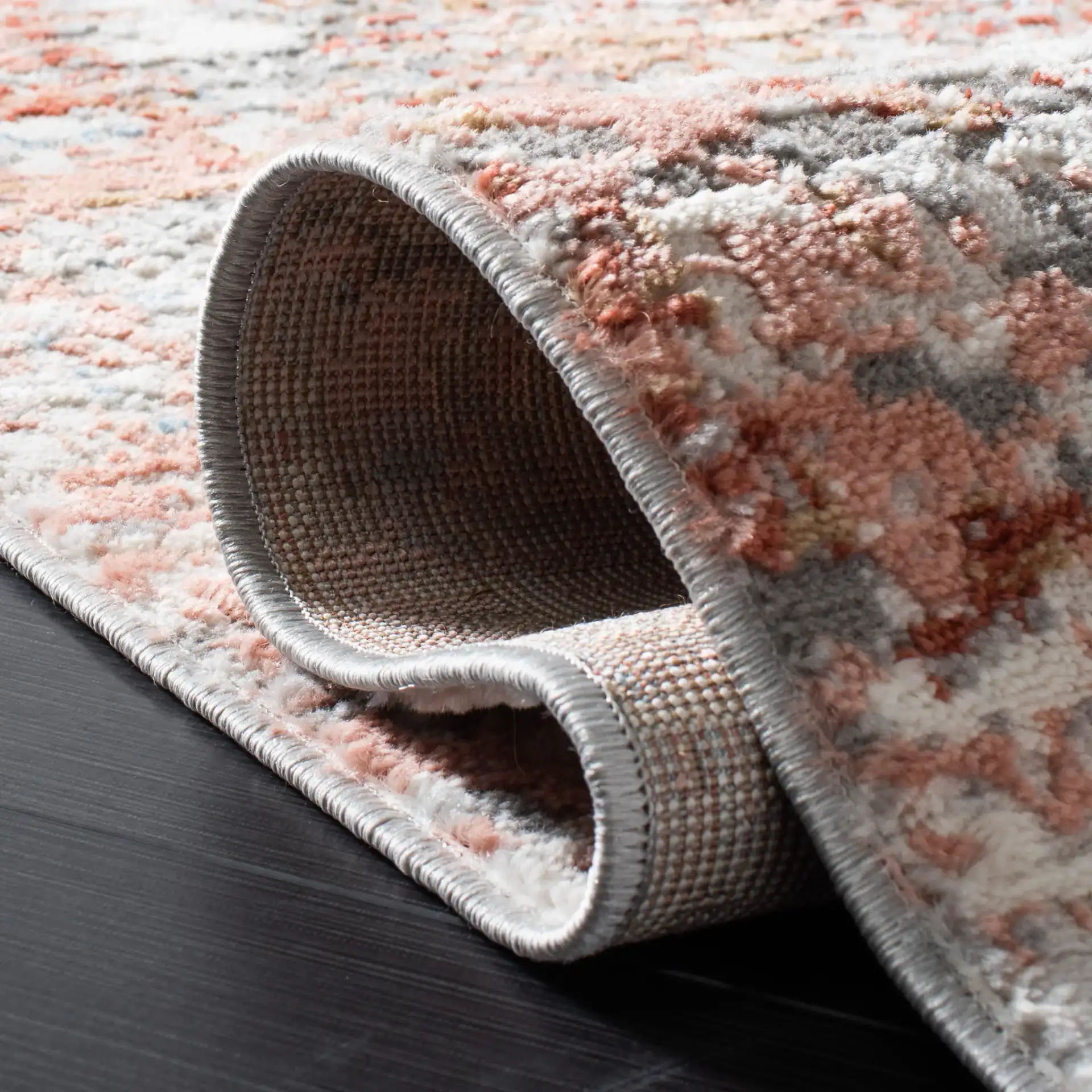 Shivan Abstract Mottled Rug in Ivory / Rust in a styled room