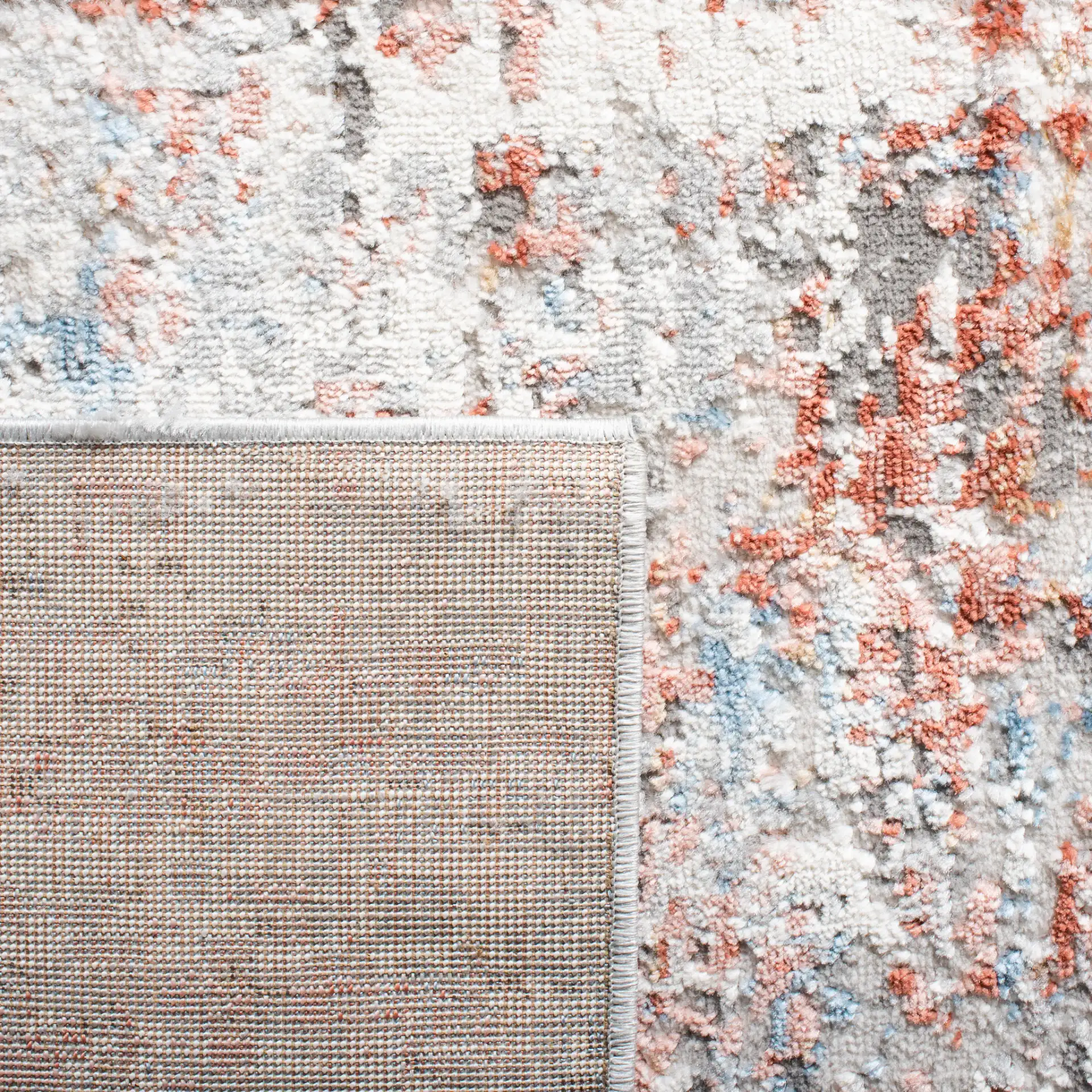 Shivan Abstract Mottled Rug in Ivory / Rust in a styled room