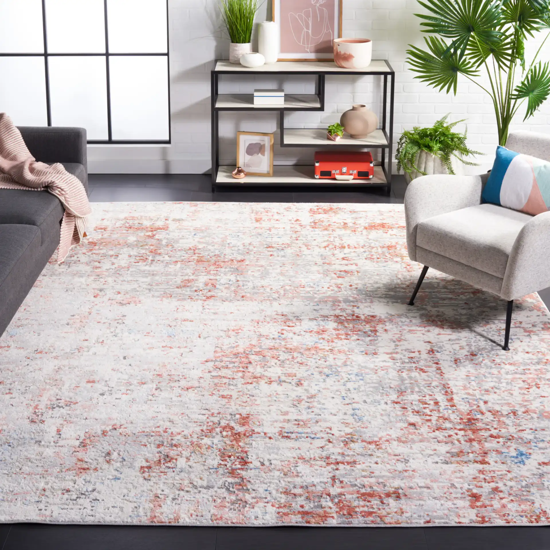 Shivan Abstract Mottled Rug in Ivory / Rust in a styled room
