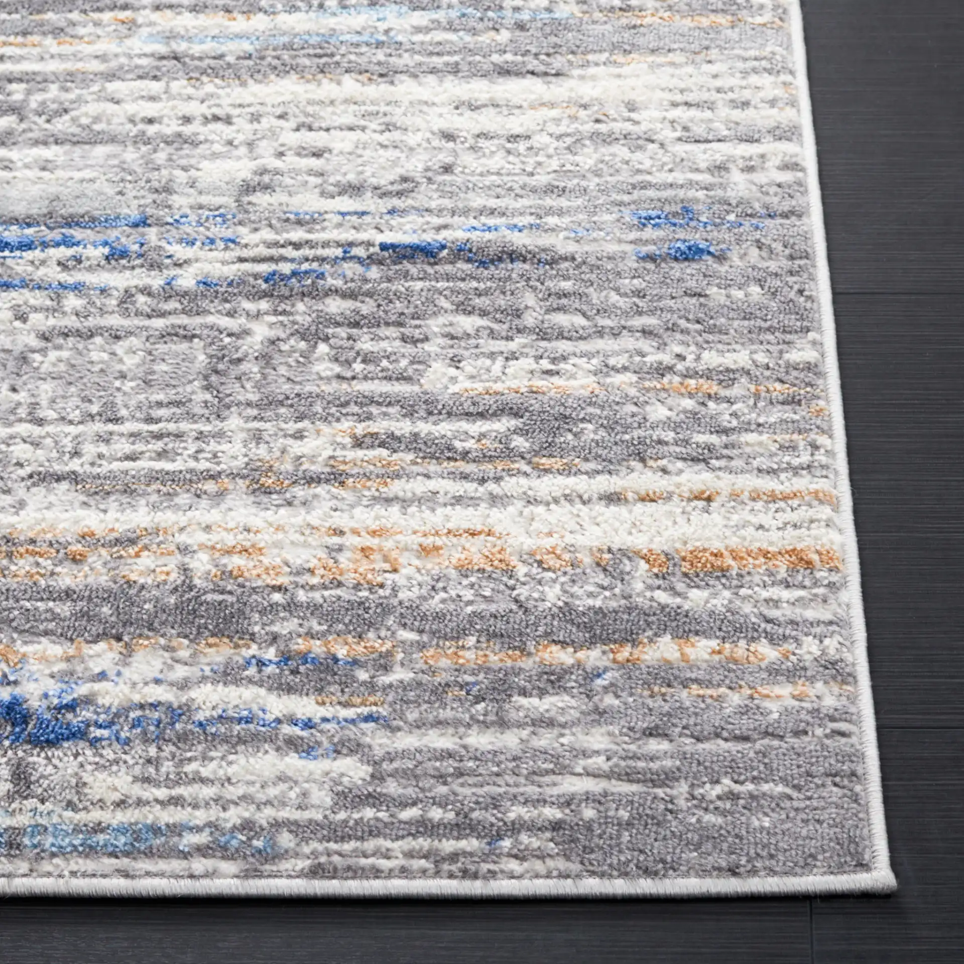 Shivan Abstract Striations Rug in Light Gray / Blue in a styled room