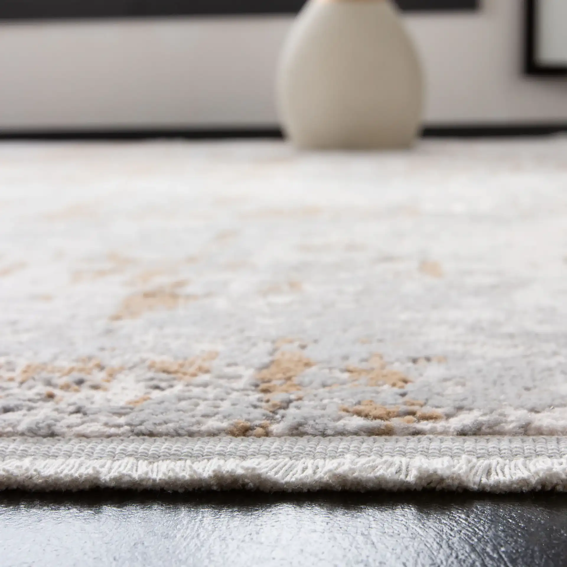 Shivan Distressed Abstract Rug in Gray / Gold in a styled room