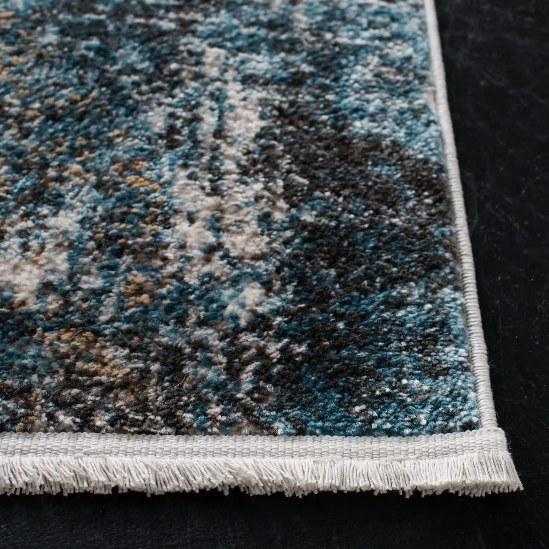 Shivan Abstract Distressed Rug in Ivory / Gray in a styled room