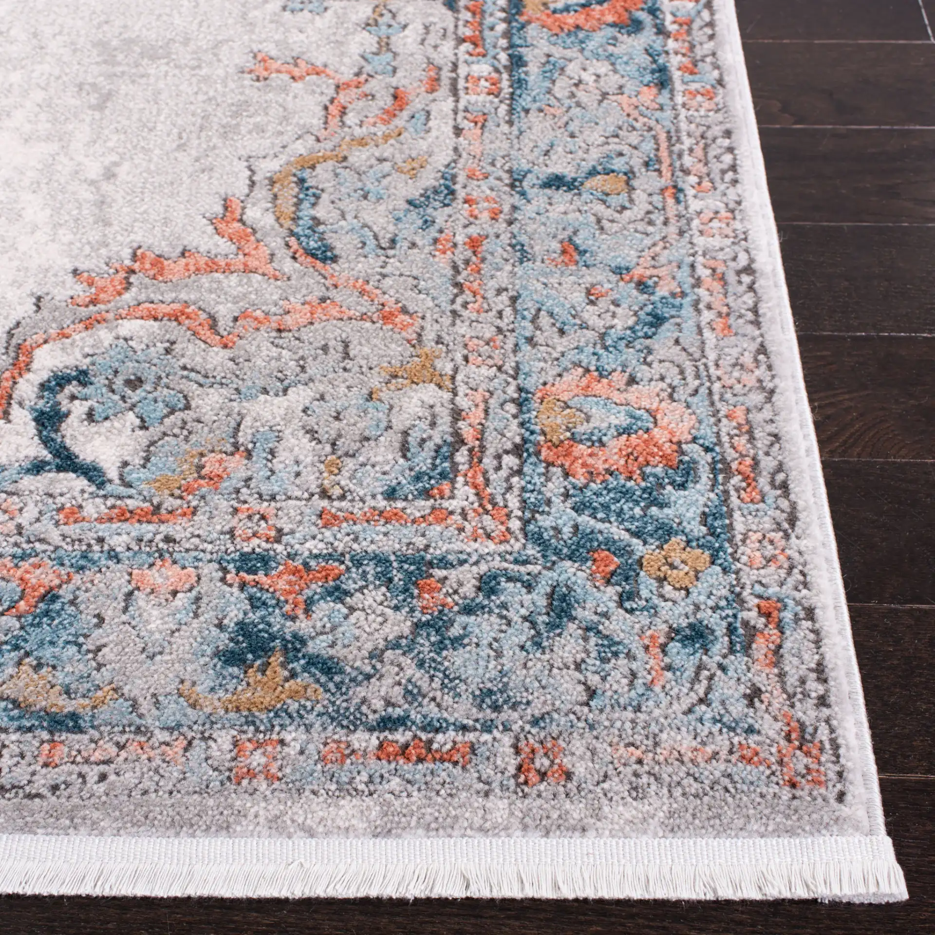 Shivan Medallion Bordered Rug in Gray / Blue in a styled room