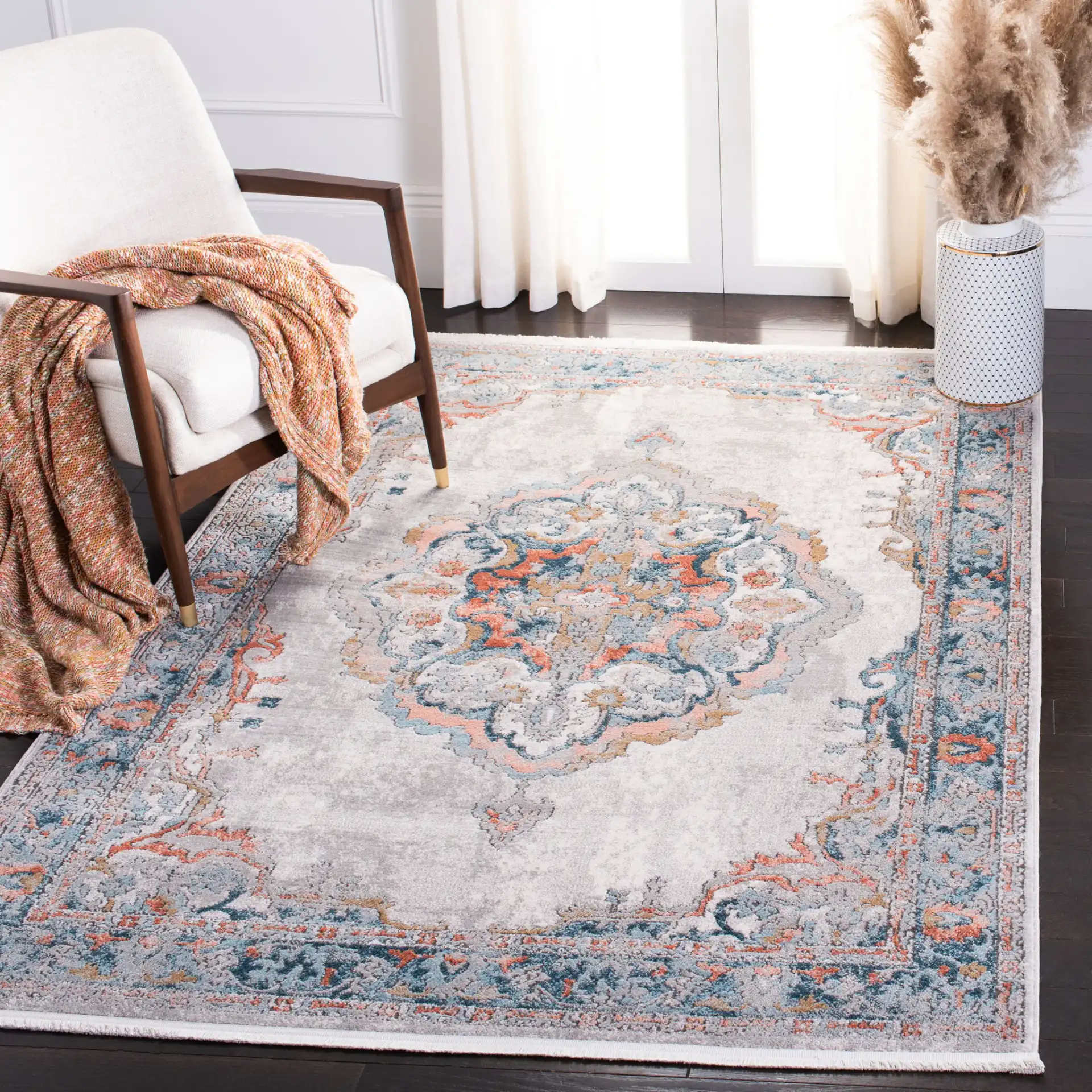 Shivan Medallion Bordered Rug in Gray / Blue in a styled room