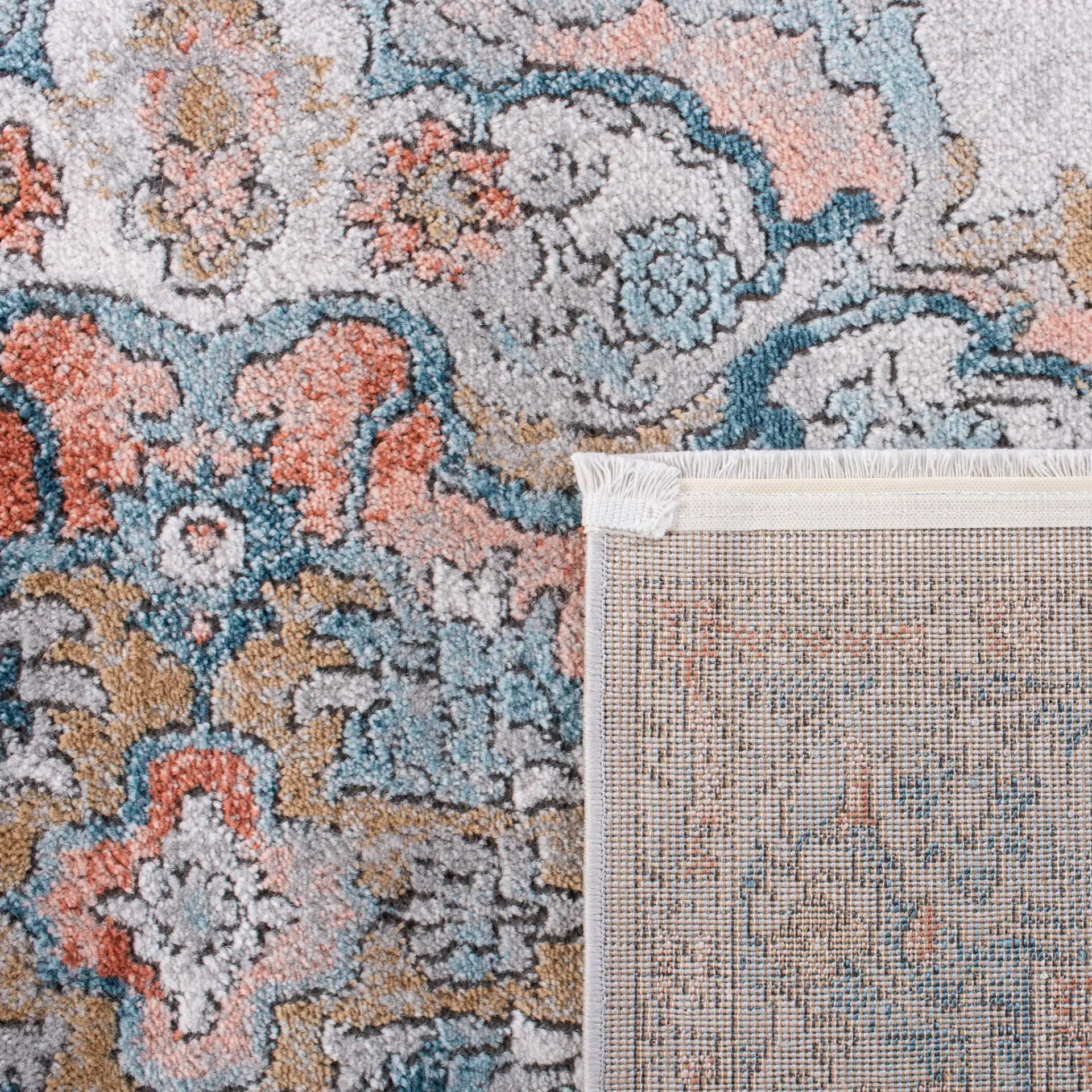 Shivan Medallion Bordered Rug in Gray / Blue in a styled room
